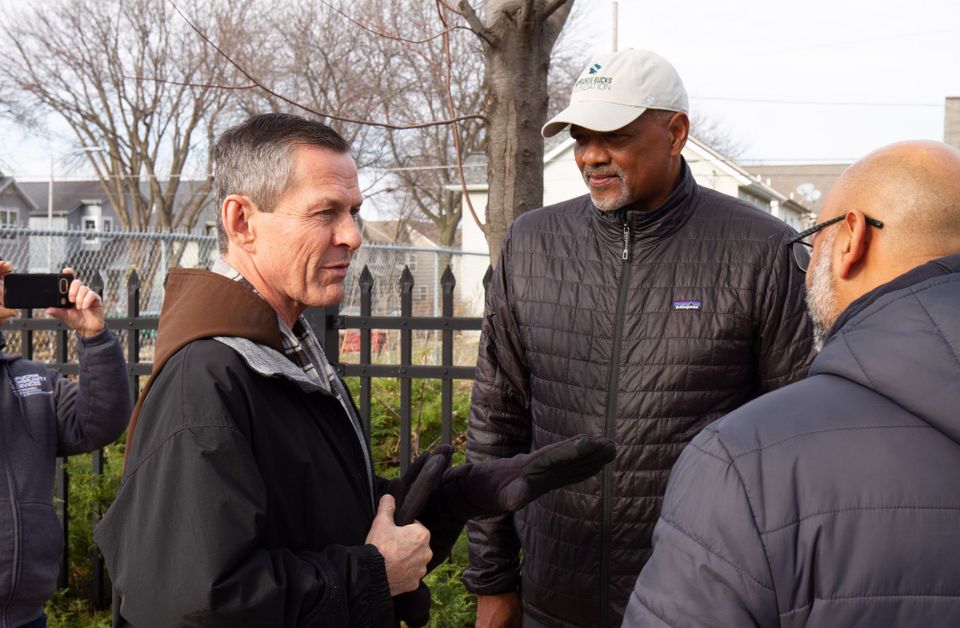 Fr. Mike Bertram speaking with volunteers at the House of Peace in Milwaukee.