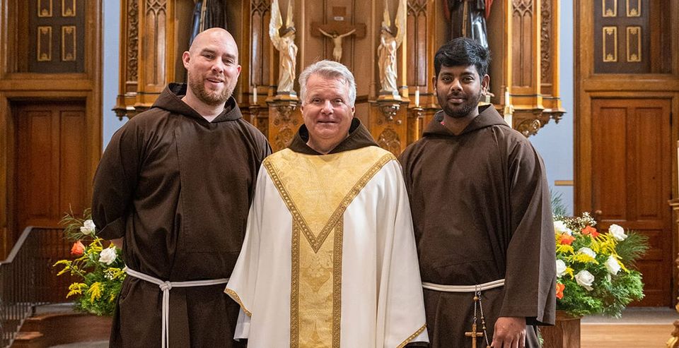 Friars Igor De Bliquy and Layola Keerthivasan Francis, pose with Provincial Minister Mark Joseph Costello.