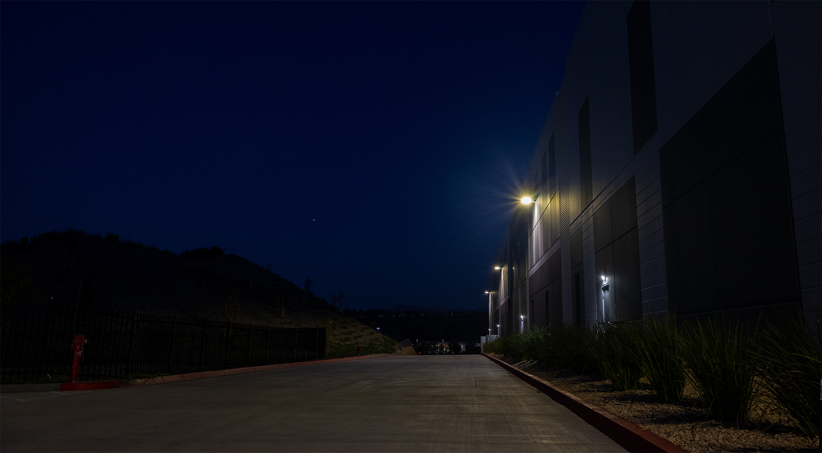 South side of the AllGo warehouse, night