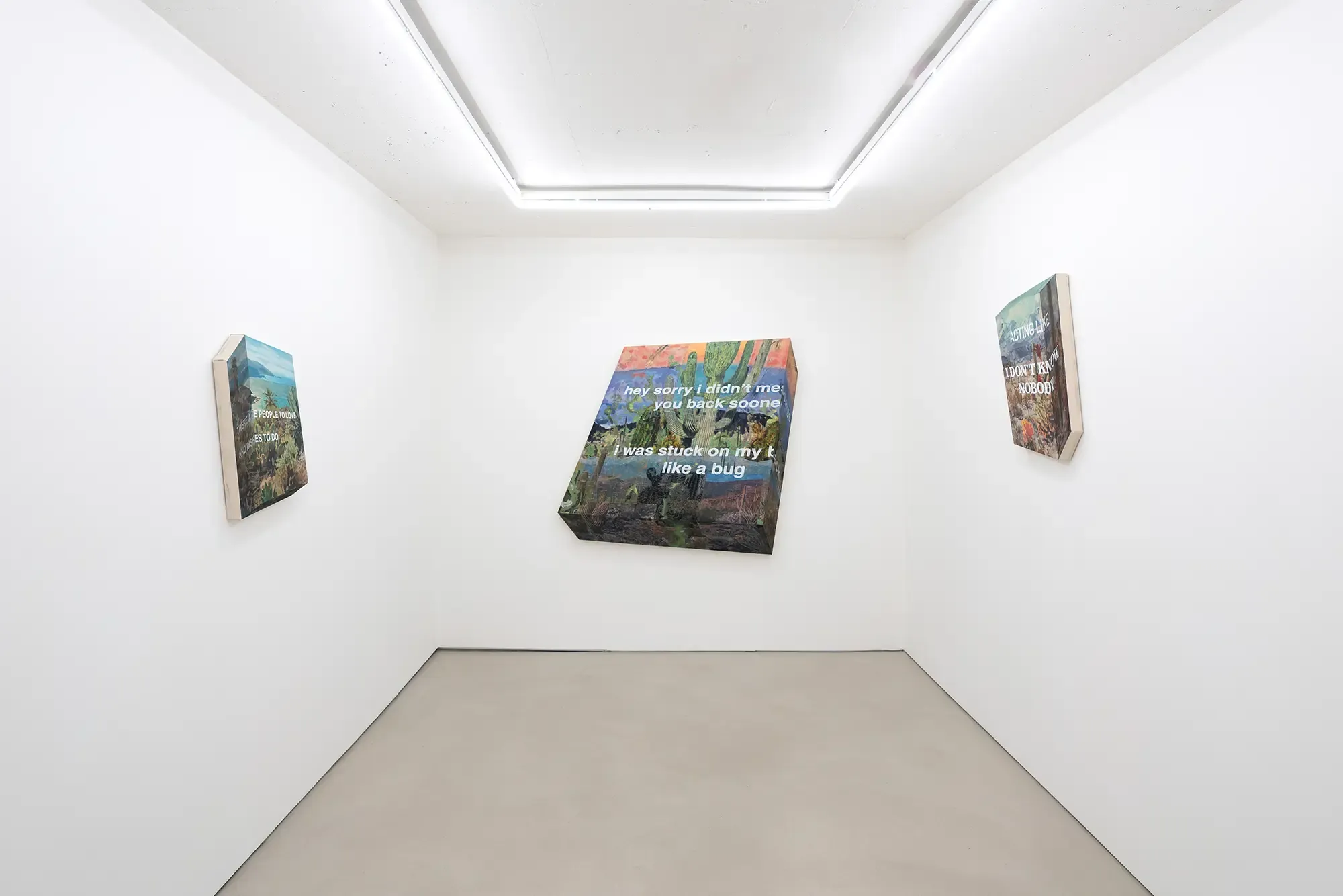 michael rikio ming hee ho installation view at sangheeut gallery featuring three text-based mixed media artworks on a white wall