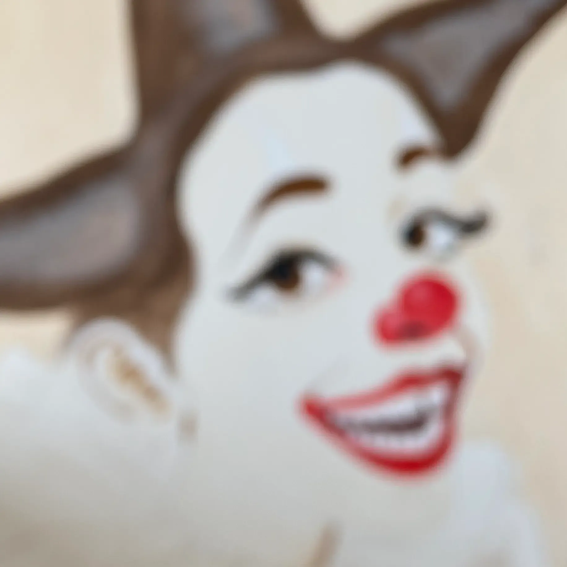 selver yıldırım blurred spray paint work of a smiling clown with a red nose and expressive eyes