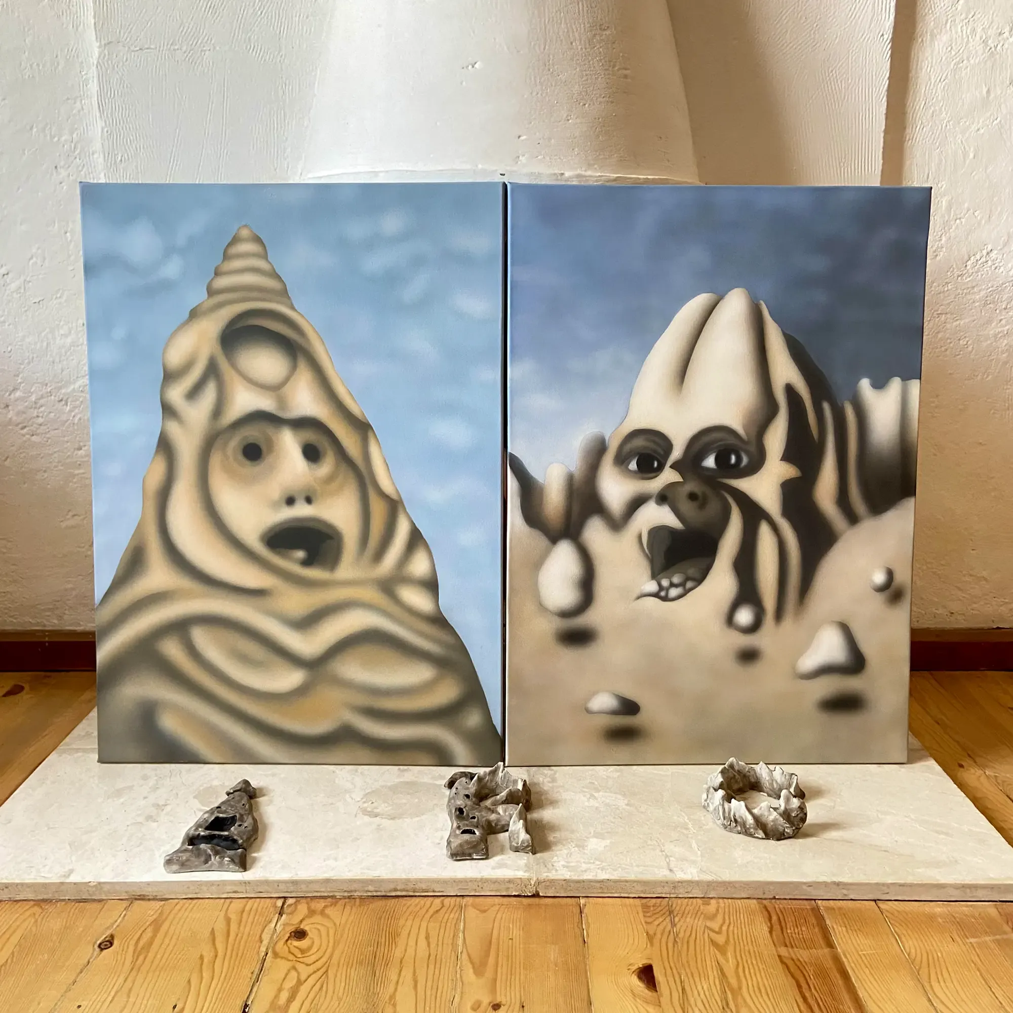selver yıldırım's surreal mountain paintings with expressive faces, created during her artist residency in cappadocia, turkey