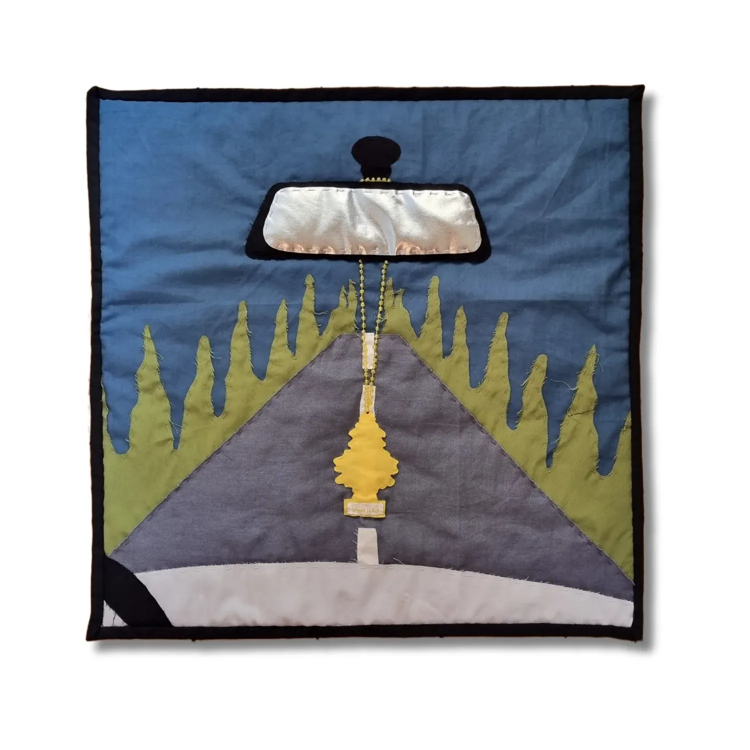 Wunderbaum Vanilla (Little Tree Vanilla) (2025), cotton, polyester, and beads, 52 × 53 cm. A scented icon reimagined in stitches—Rosinski’s textile piece freezes the fleeting moment of a car ride into a static symbol of gendered nostalgia and consumer ritual. The banal becomes sacred. The decorative becomes diagnostic. Courtesy of and with permission by the artist Rosina Rosinski.