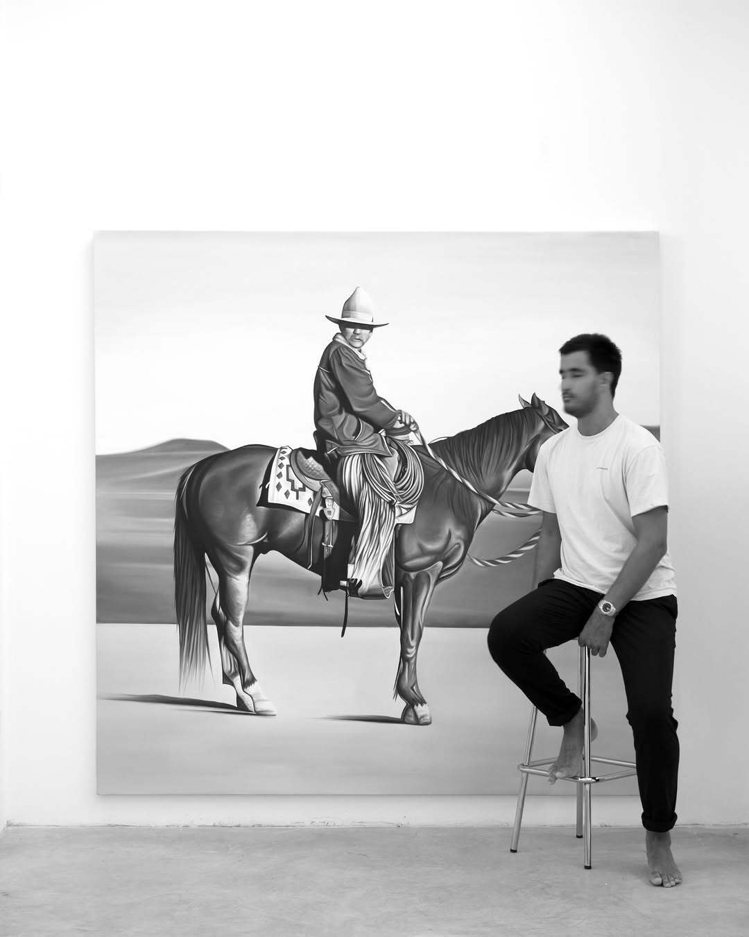 Black-and-white oil painting of galloping horse and cowboy, exploring masculinity and Western nostalgia by Ricardo Rodriguez Cosme