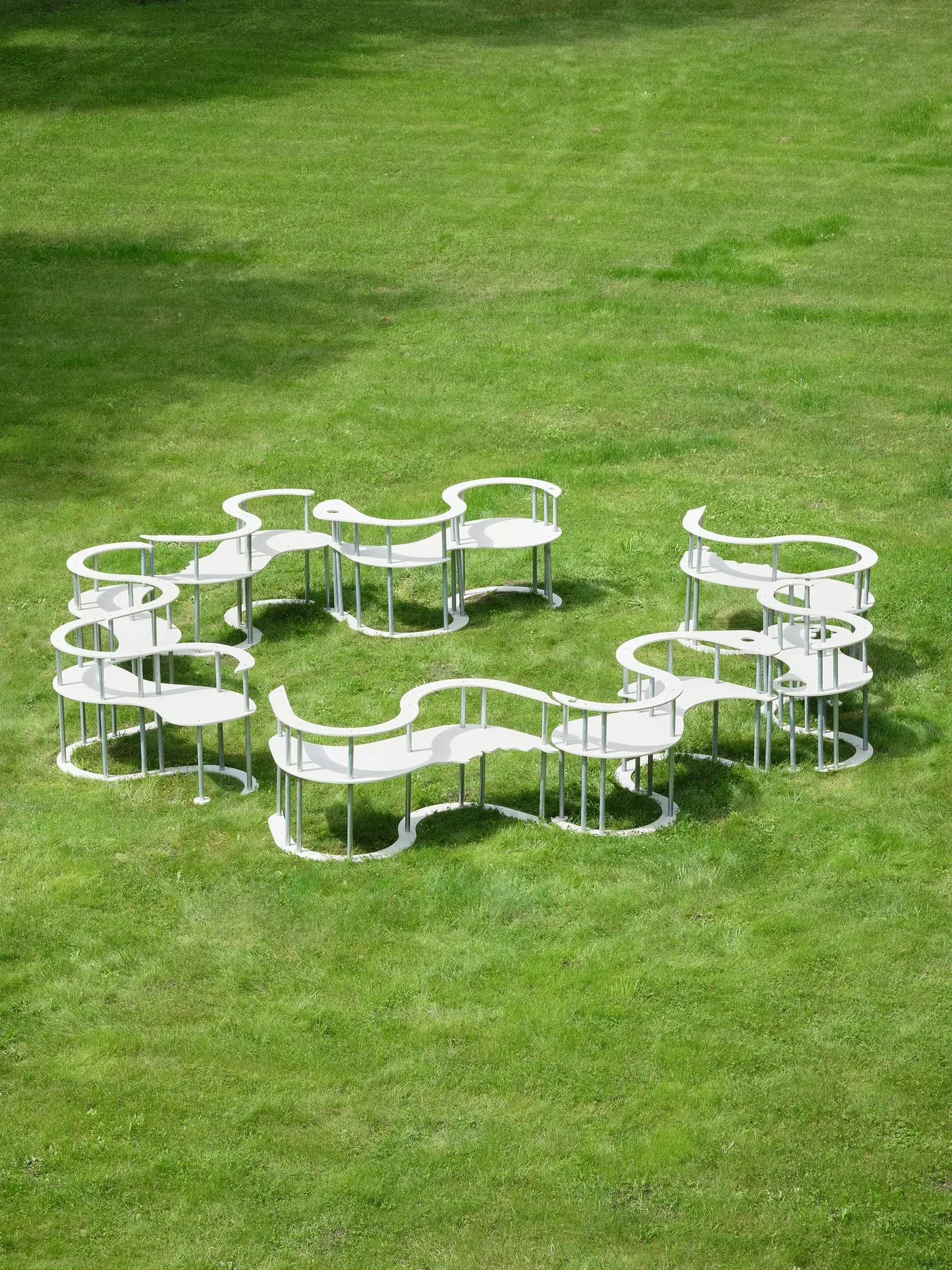 outdoor installation by lena marie emrich, gossip chairs (2024), modular white seating arranged in a circle at wehrmühle for some degree of friction 2025.