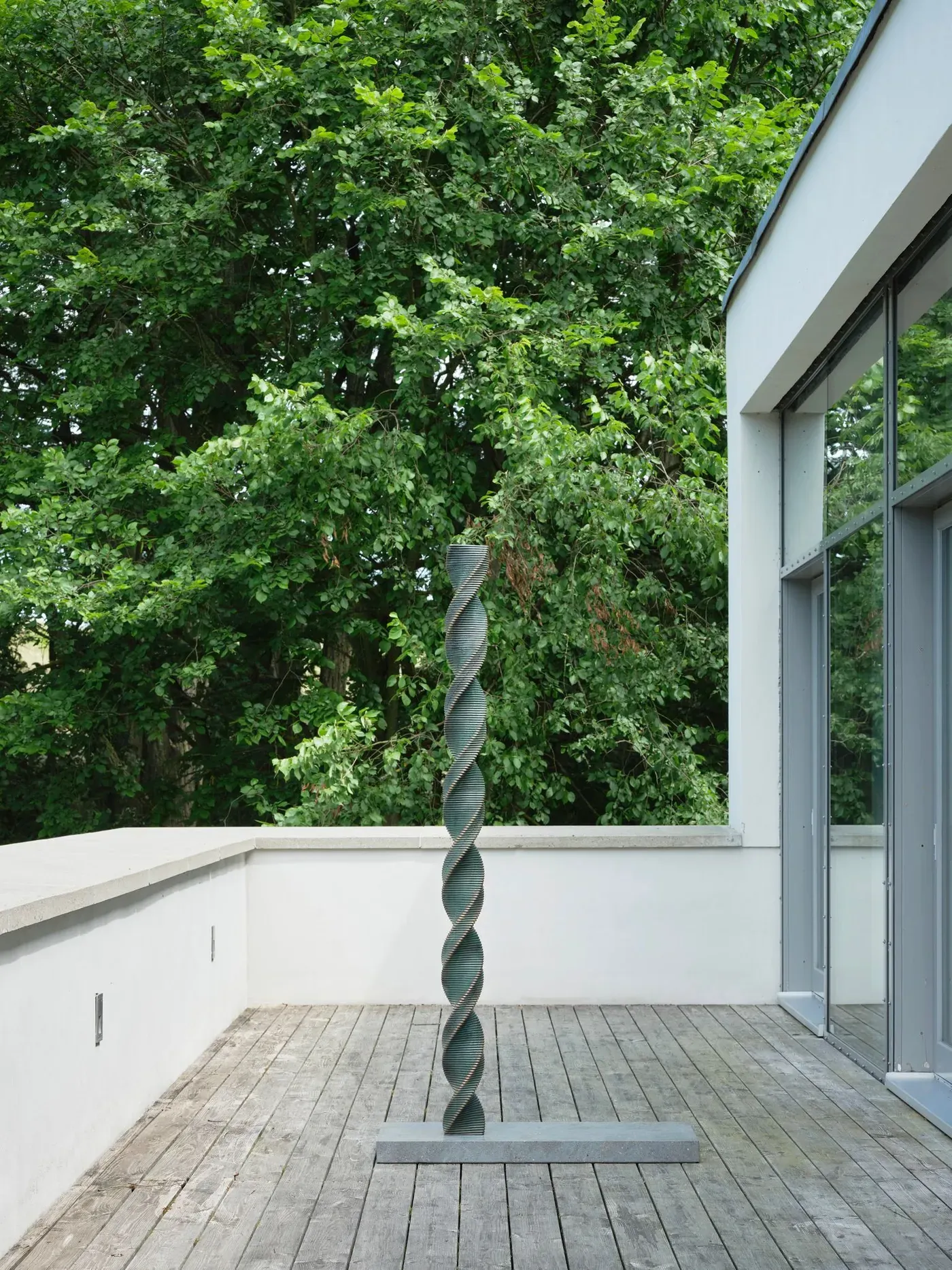 sculpture by alicja kwade, principium (2020), spiral form installed at wehrmühle biesenthal for the group exhibition some degree of friction 2025.