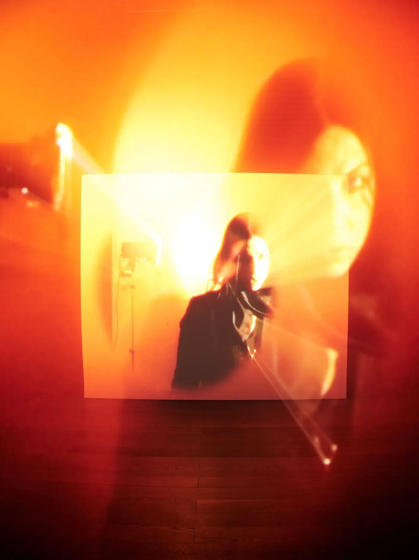 Video installation with glowing orange light projections shown at Wehrmühle Biesenthal for the exhibition Some Degree of Friction 2025.