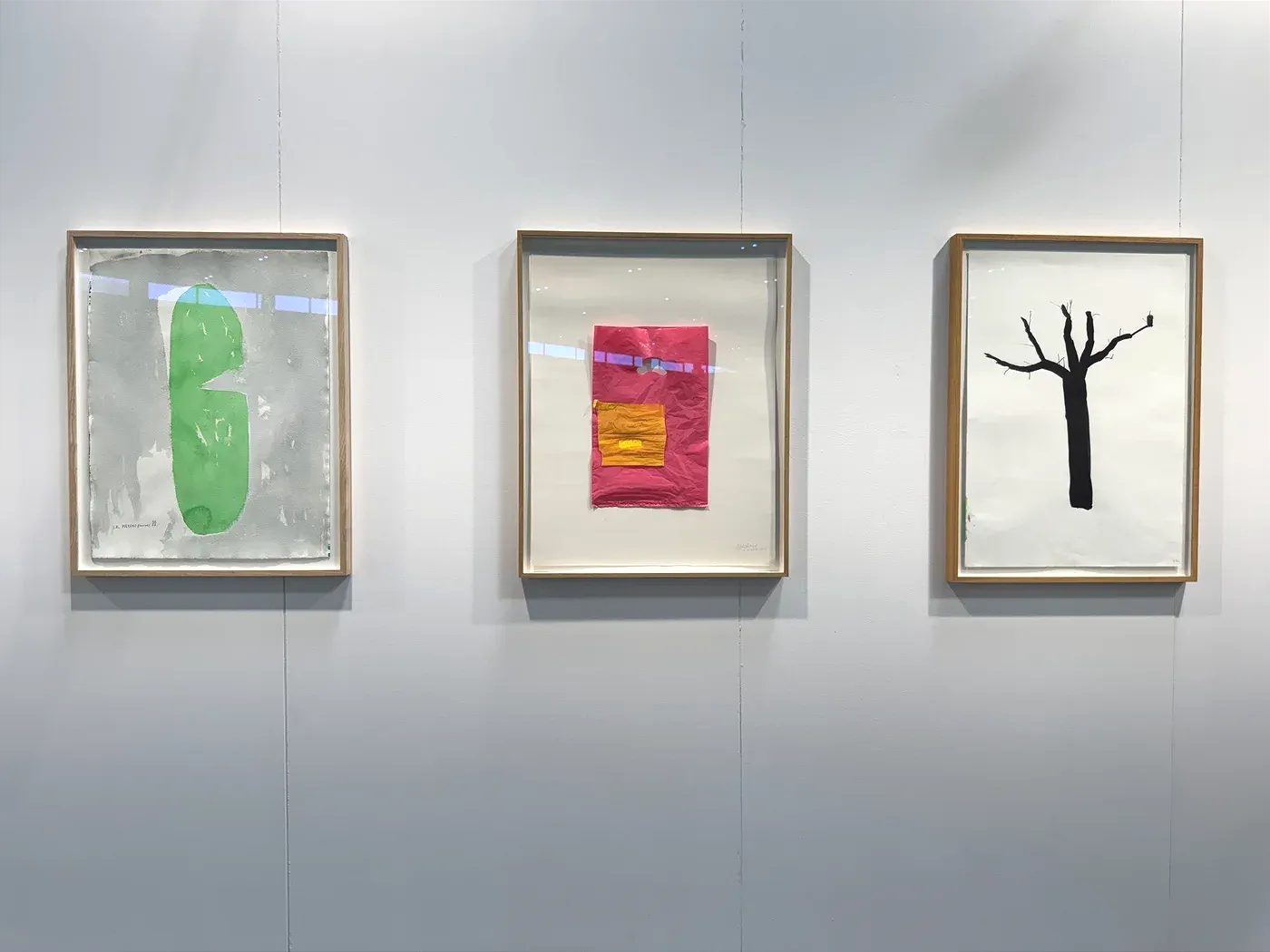 Contemporary Vienna art fair 2025, Messe Wien: three framed works by Ivan Kožarić at Galerija Gregor Podnar—green biomorphic shape, magenta–orange block, and black tree on white.