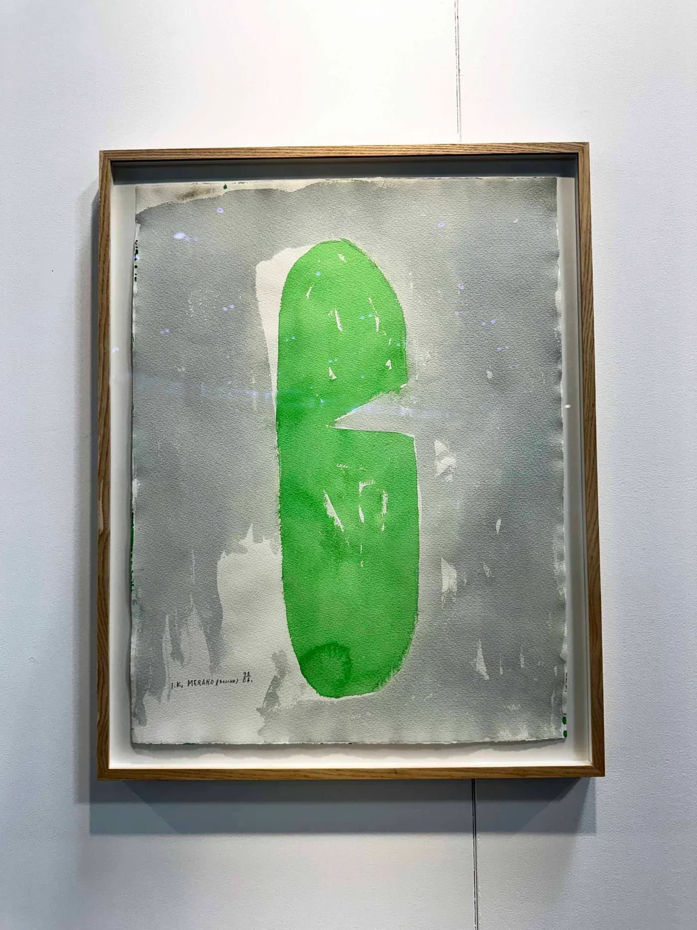 Contemporary Vienna art fair 2025, Messe Wien: Ivan Kožarić work on paper at Galerija Gregor Podnar, elongated green shape on grey ground in a wooden frame.