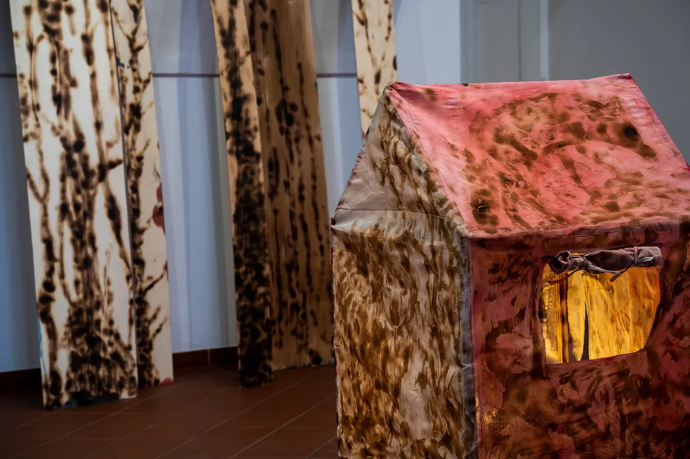 olga pastekova, textile house installation, stained fabric contemporary art, exhibition the world in between