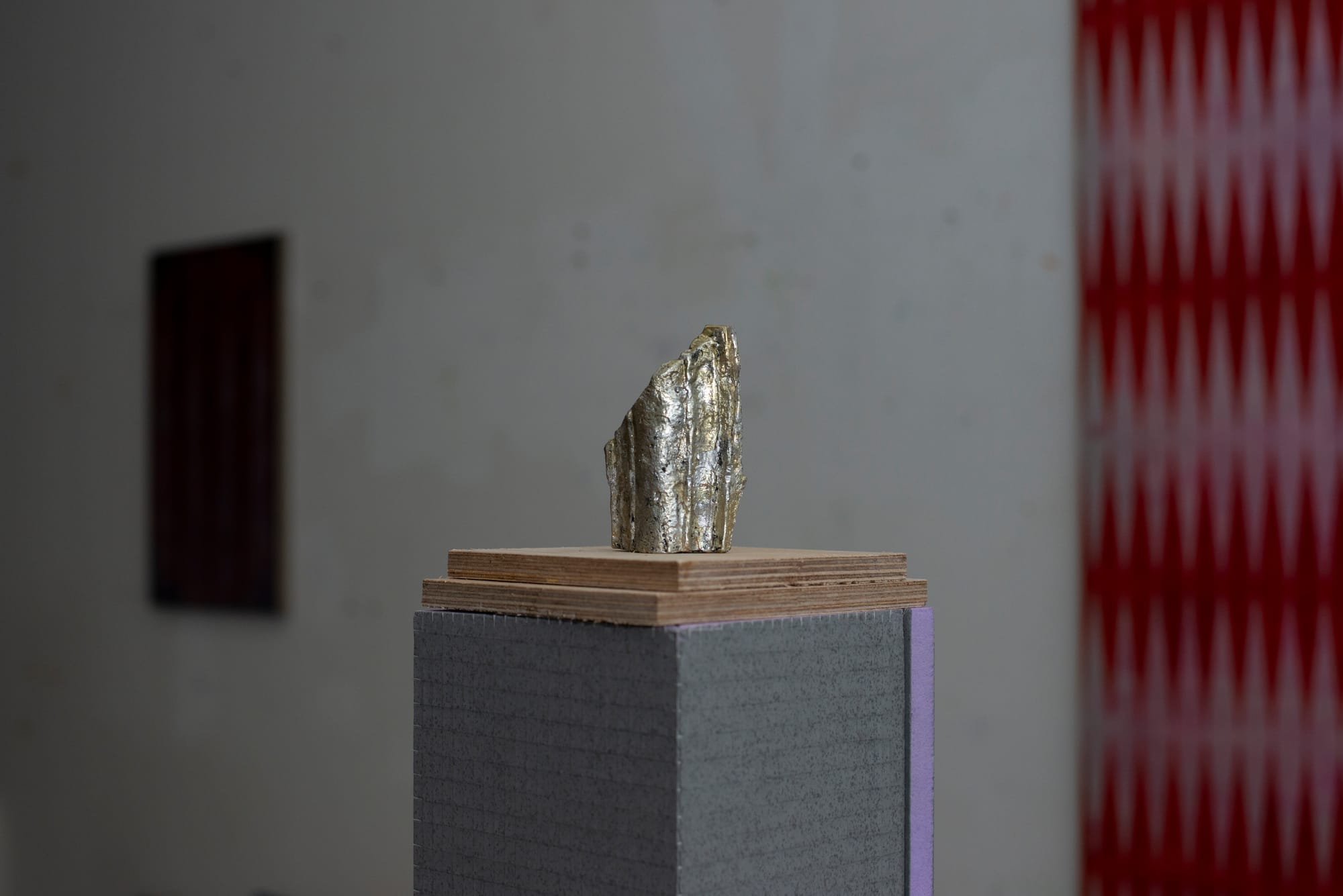 Matthias sculpture small on a pedestal part of a series, on view exhibition.