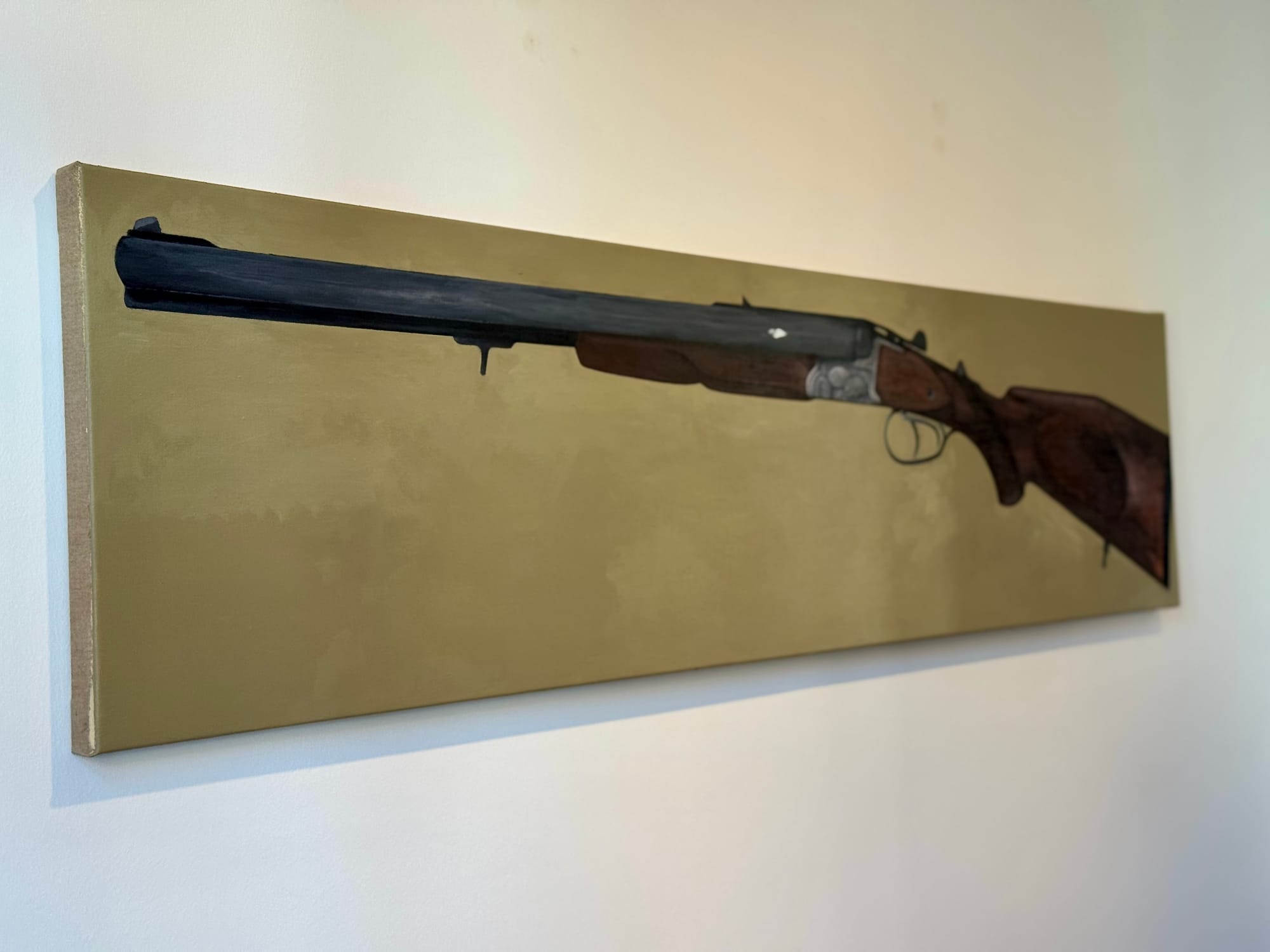 Alt text: Long horizontal canvas with painting of a rifle from Tin Trohar’s exhibition “1996” at Klubhaus, Vienna.