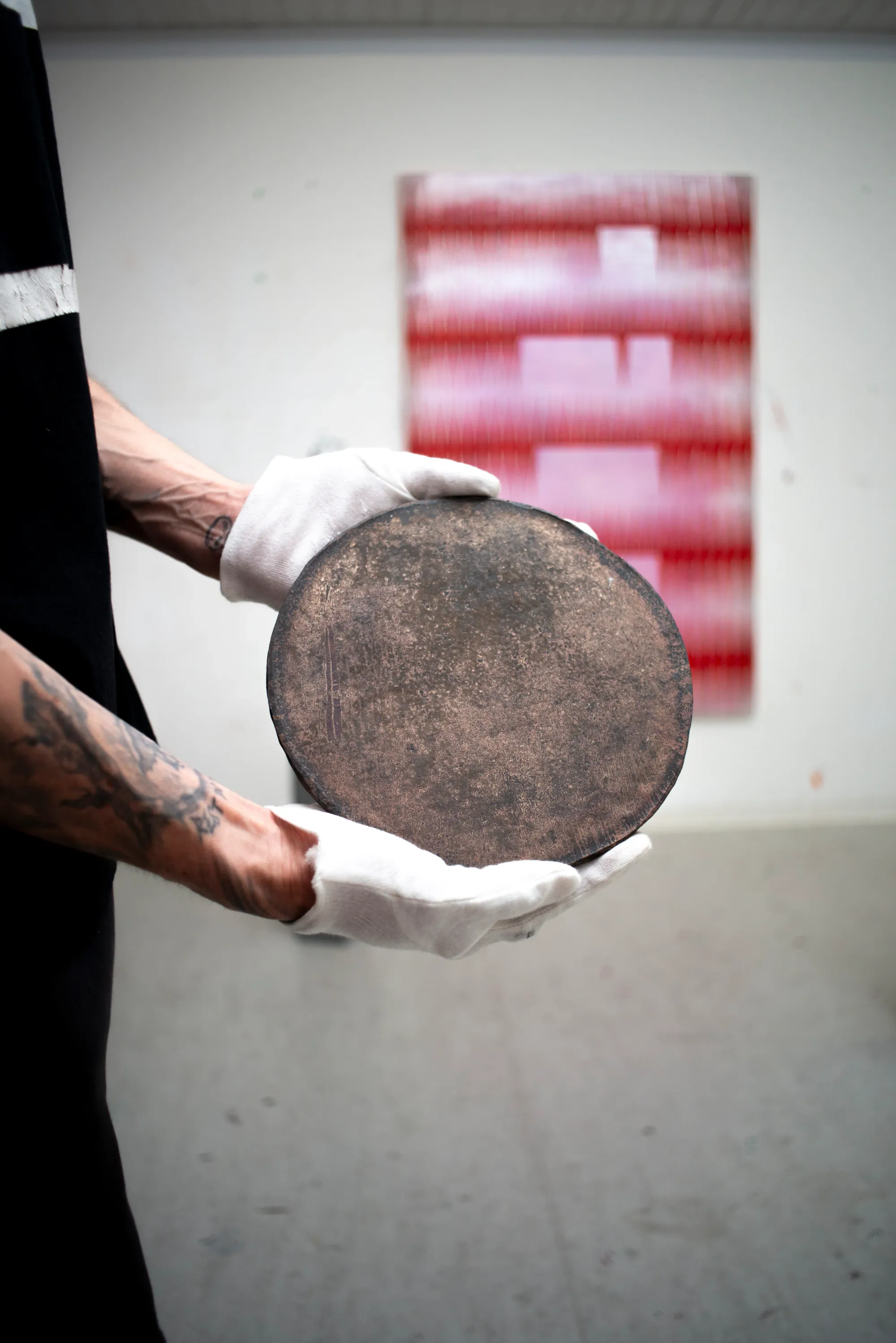 Matthias Esch holding what he calls the Sky Disc, bronze, 25 cm, 