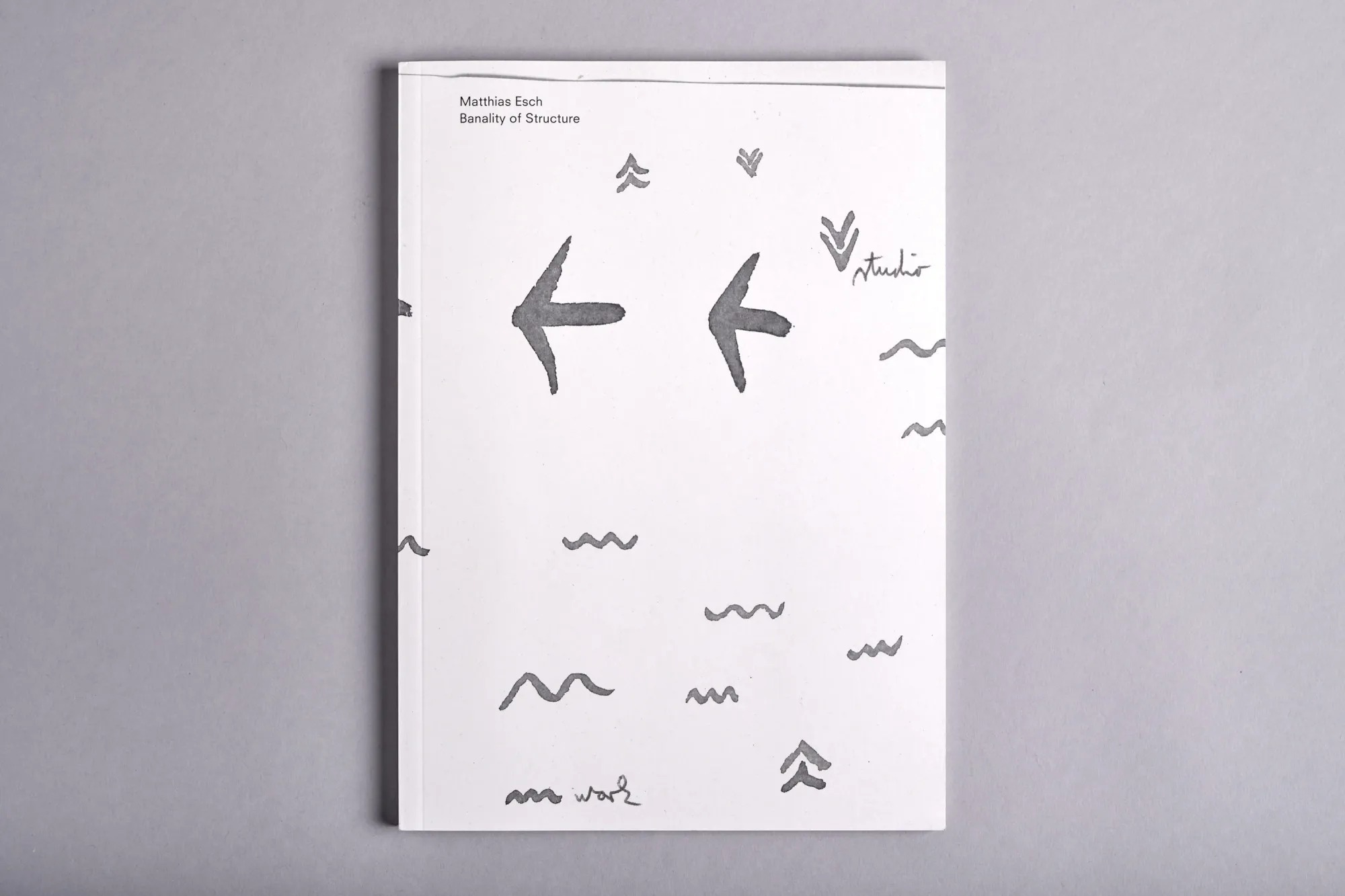 Matthias Esch, catalogue cover with minimalist arrow drawings, artist publication design, photo by Marlene Zoe Burz.