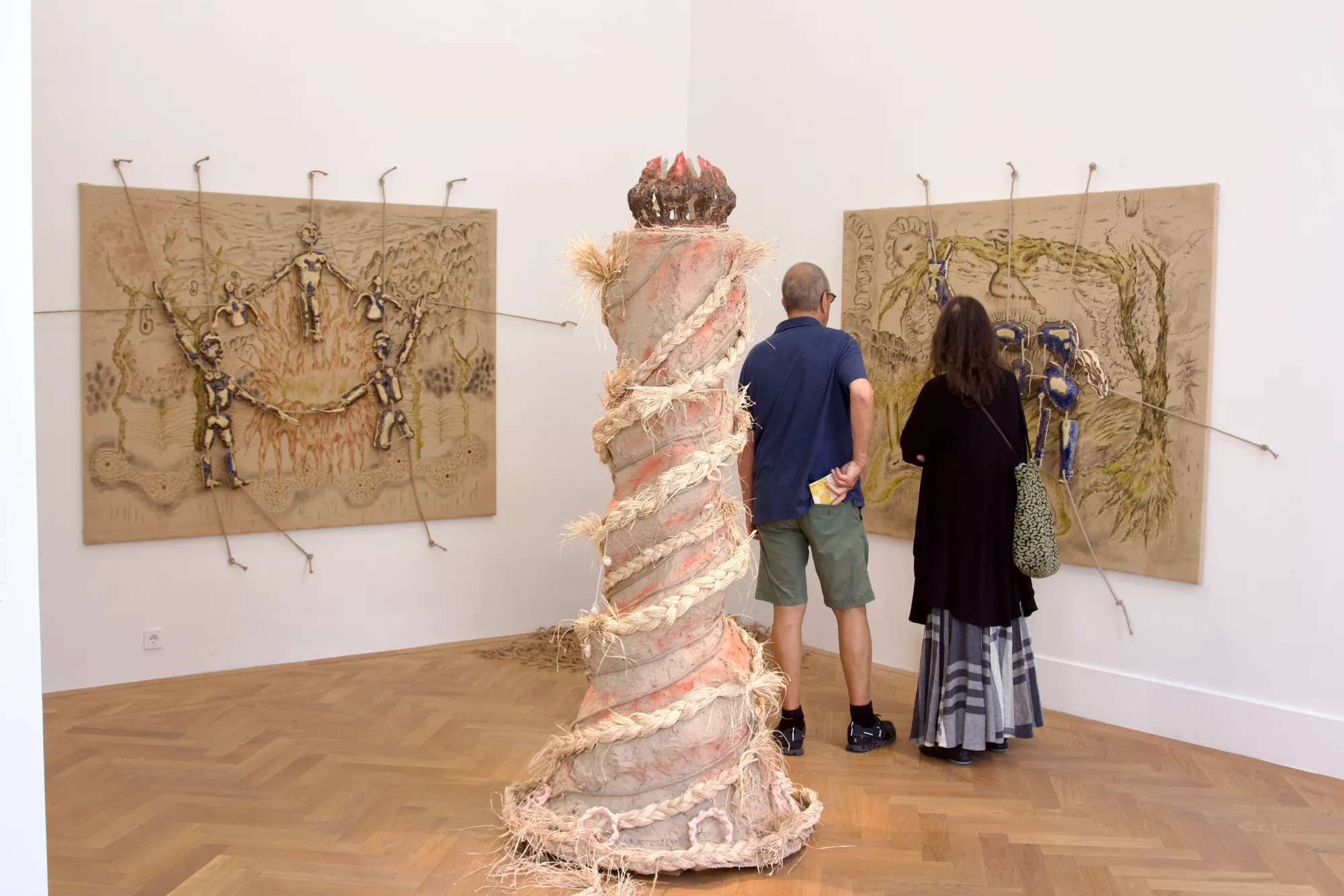 Seung-yeon Jung, Flame of Harmony, 2025, large ceramic and rope sculpture viewed by visitors at Exhibit Galerie, Vienna, Diploma Exhibition.