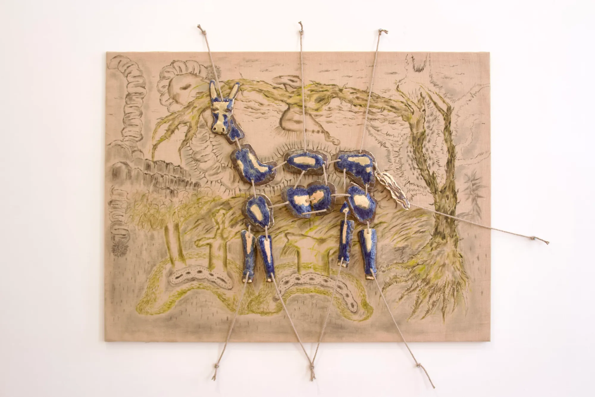 Seung-yeon Jung, diploma project The Harmony in a Book Left Unread, ceramic and jute wall installation with blue glazed forms, Exhibit Galerie, Vienna, 2025.