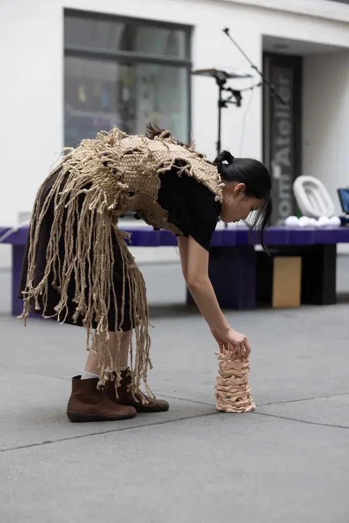 Seung-yeon Jung performing Harmony of Janggu, 2025, at Dom Museum Wien, moving with ceramic forms and rhythm, exploring friendship and cultural balance.