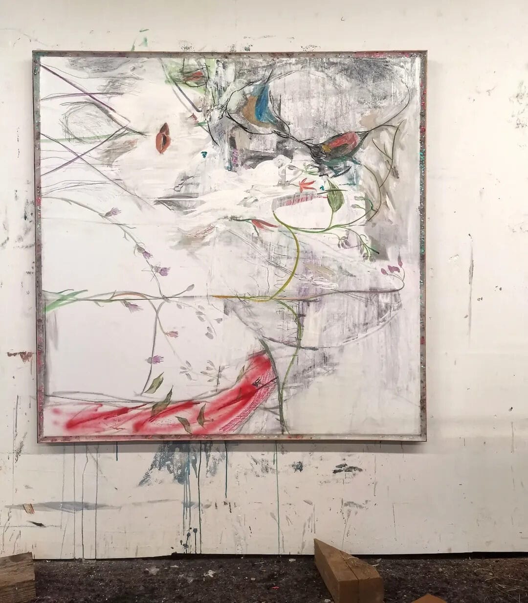 Work in progress by Ruth Devriendt in her studio, a large canvas with botanical lines and soft red and green marks, made for her recent exhibition at Black Swan Gallery. Image courtesy of the artis