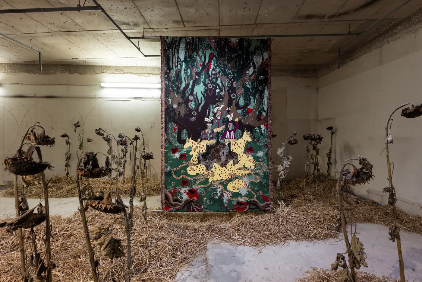 promising artist Olivia rode hvass showcase her new work as installation,  jacquard tapestry with bleeding horses and entitled hunted during Luxembourg art week , hay, sunflowers and textile storytelling at its best