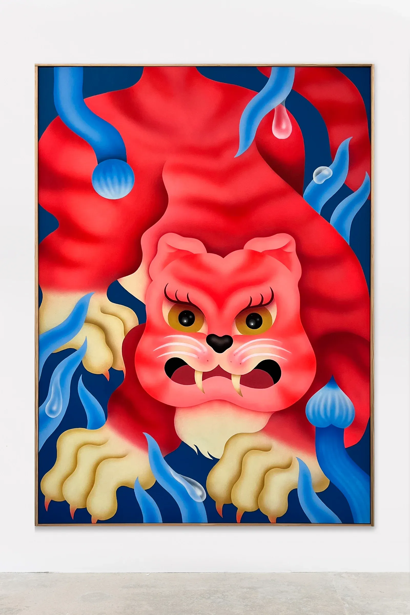 Installation view of Tiguerona by Fátima de Juan, showing a bold figurative composition with animal features and saturated color fields in an exhibition setting.