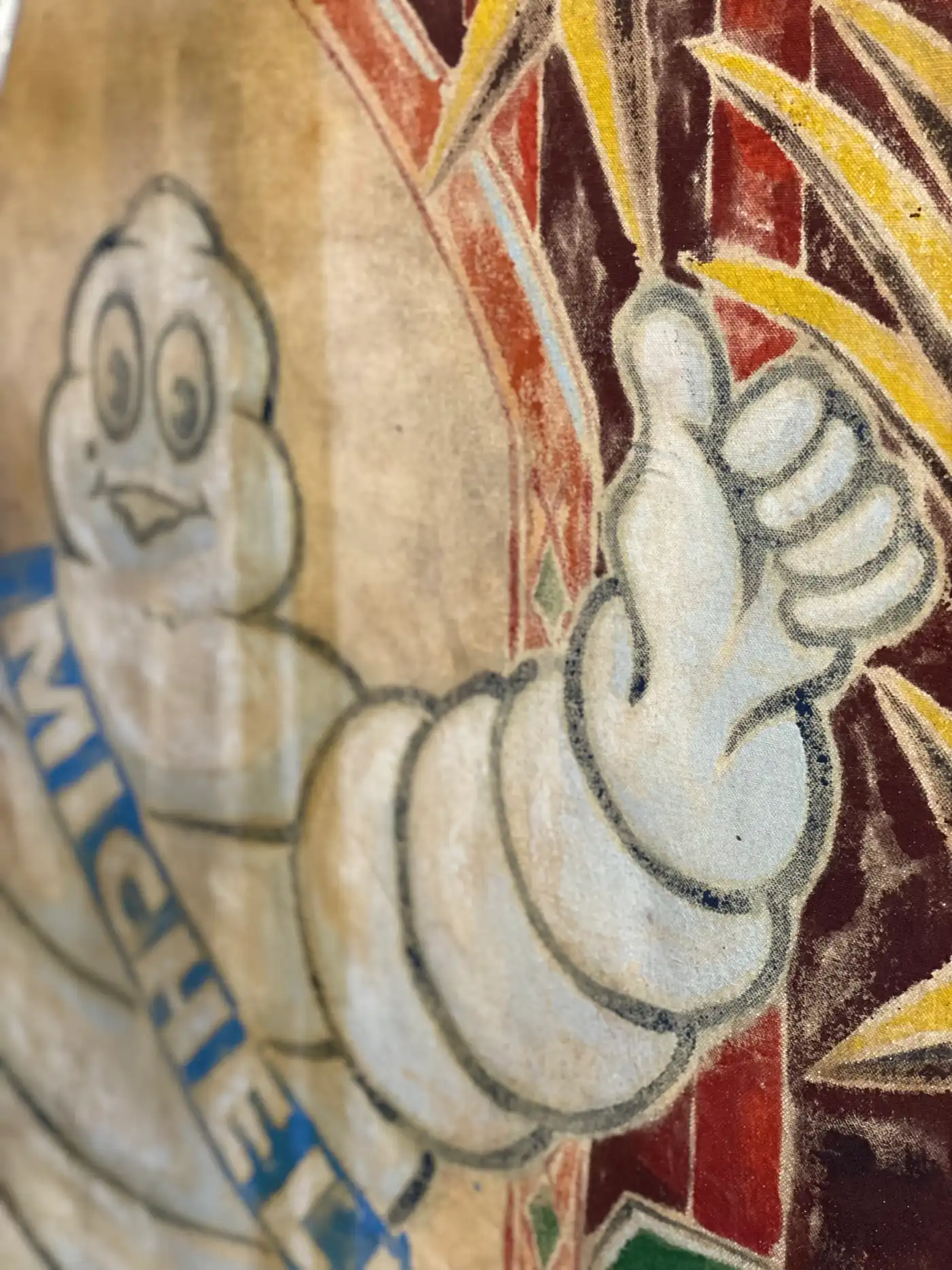 Detail view of a work in progress by Ruben Einsmann with painting tools and materials placed nearby.