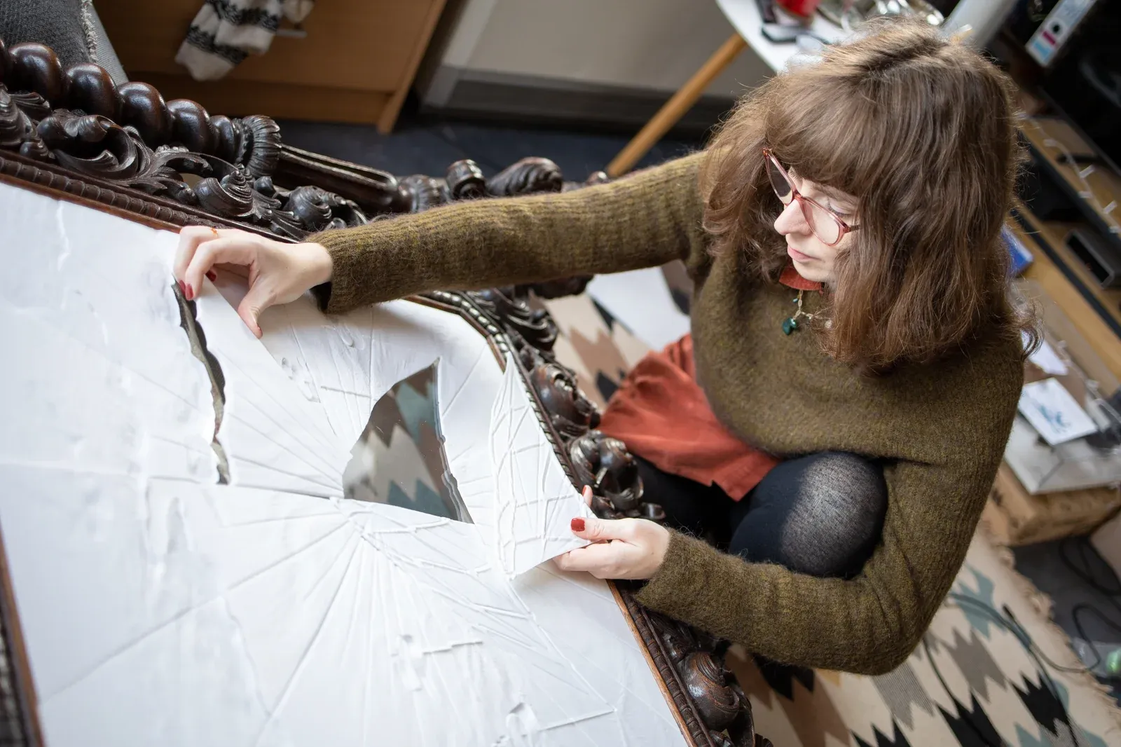 Interior view of Martha Kicsiny’s studio showing drawings, architectural motifs and light-responsive works.