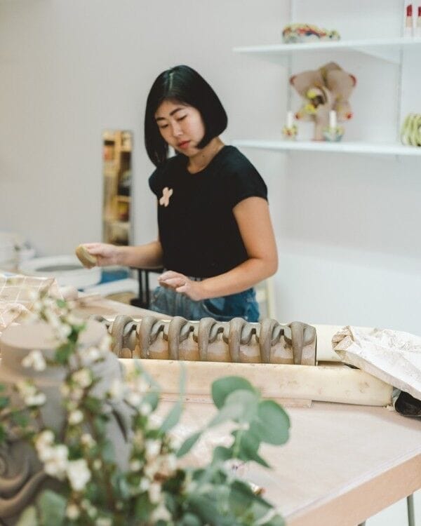 eri maeda - artist interview about social media , image in her studio crafting colorful ceramic in Paris