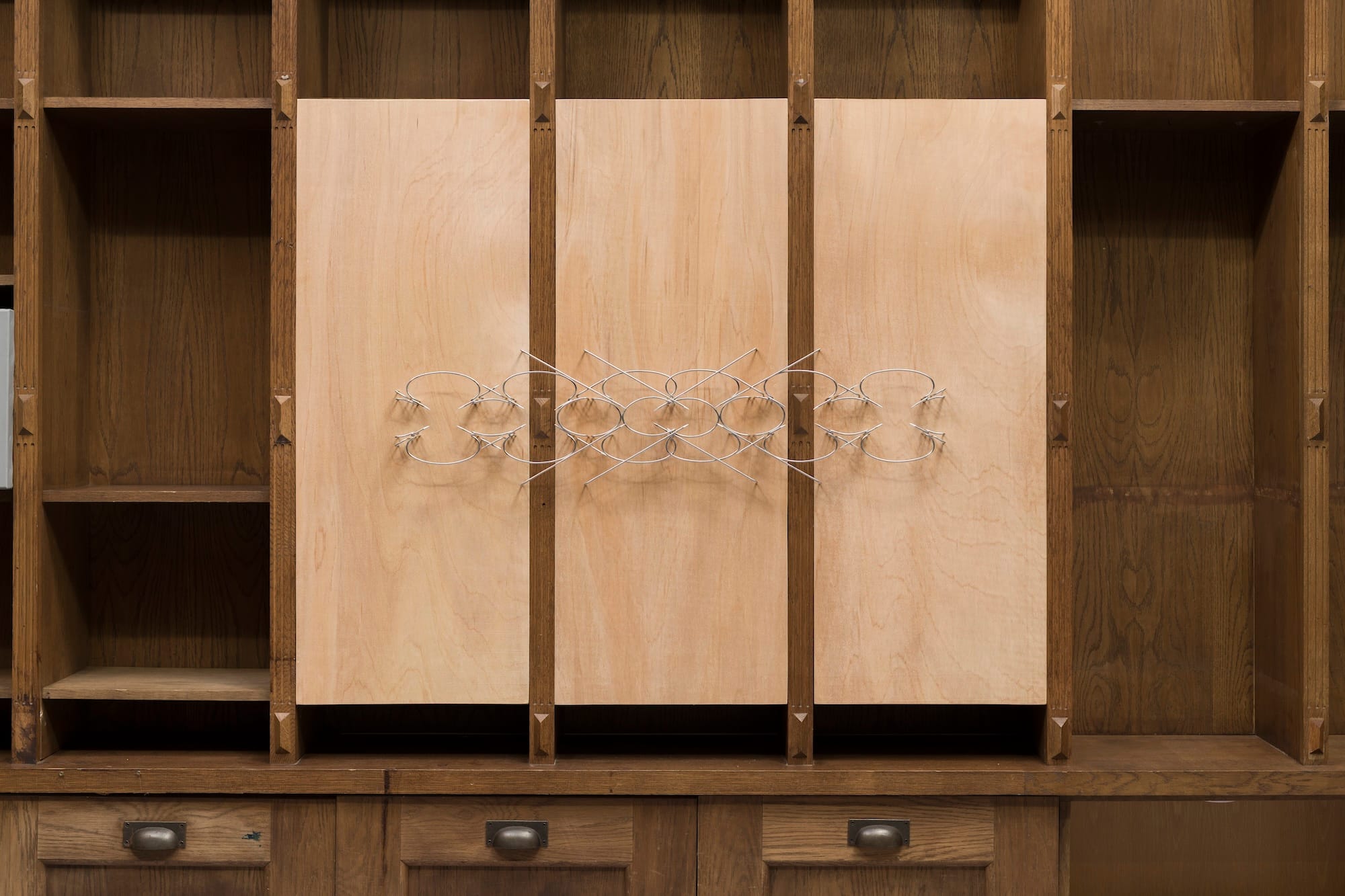 Aluminium wall sculpture An den Wassern zu Babel (2026) by Ben Grosse-Johannboecke installed on wooden panels in the exhibition Bitter Spring at MARA Projects, London.