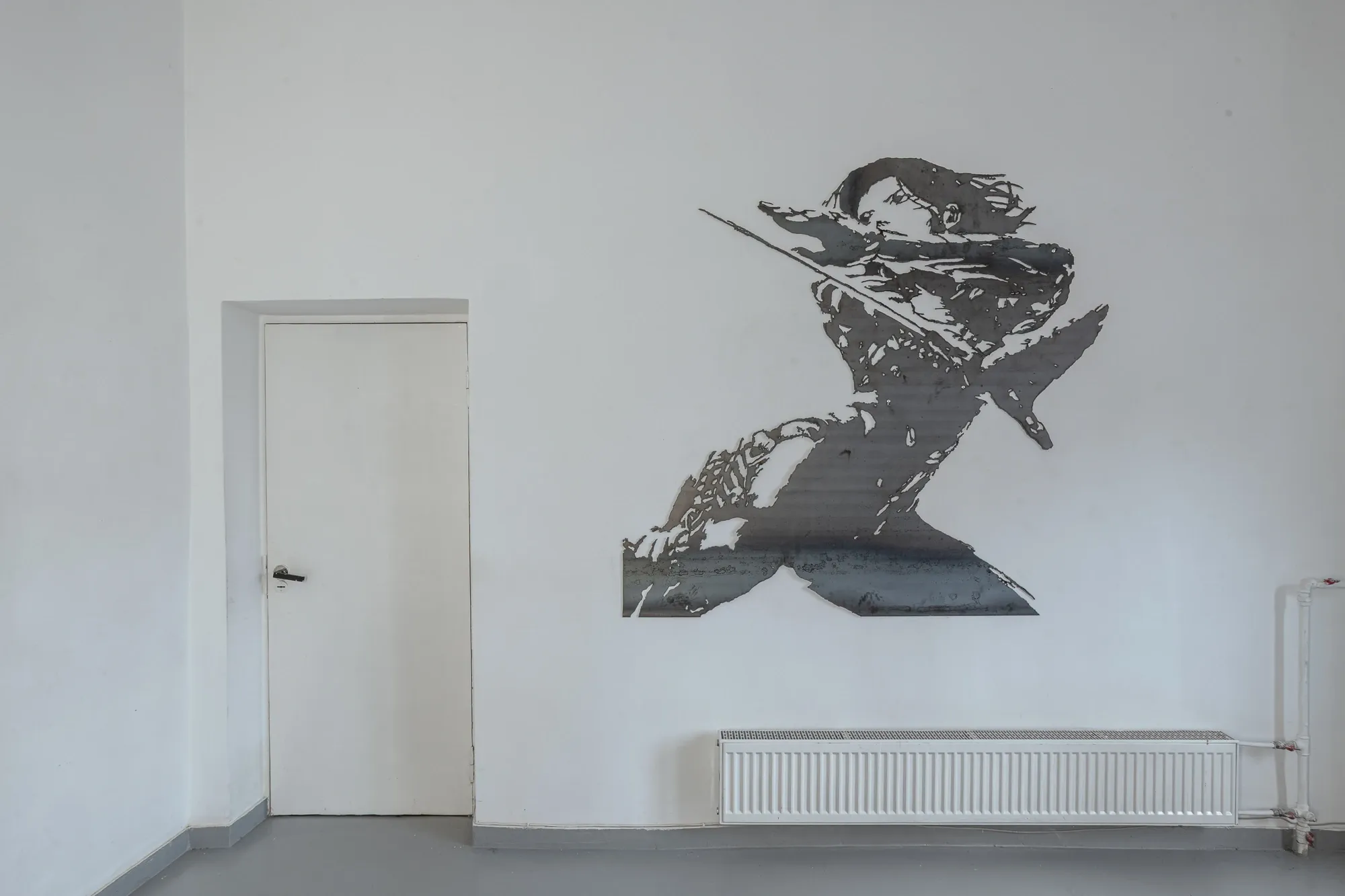 Liudvikas Kesminas , ghost in the shell cut from one piece of metal, wall installation