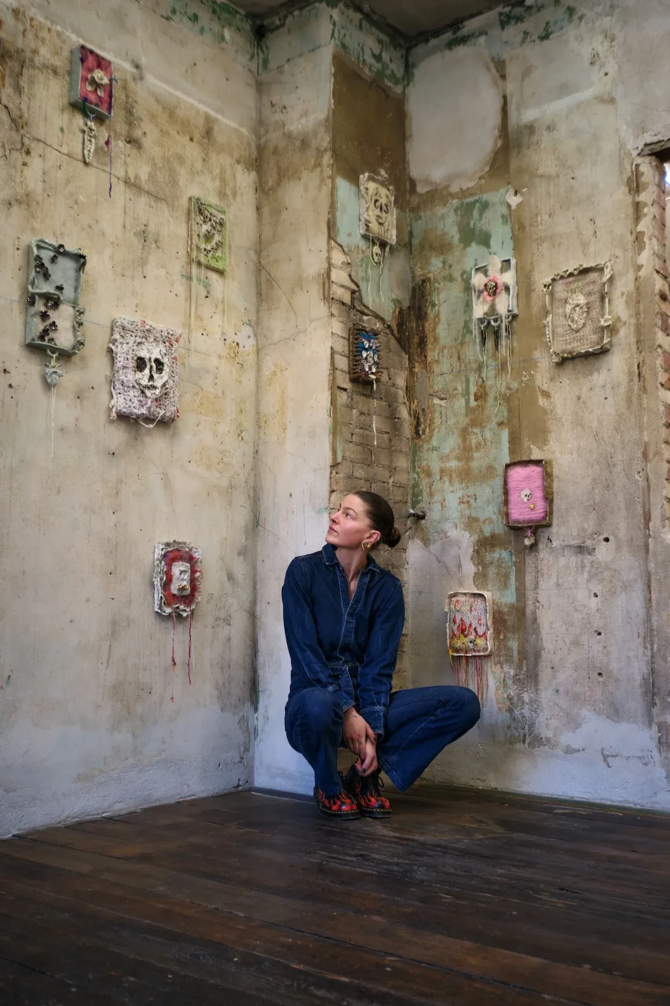 Artist Julie Wittrup with textile and ceramic wall works in the exhibition Echo at HAGD Contemporary