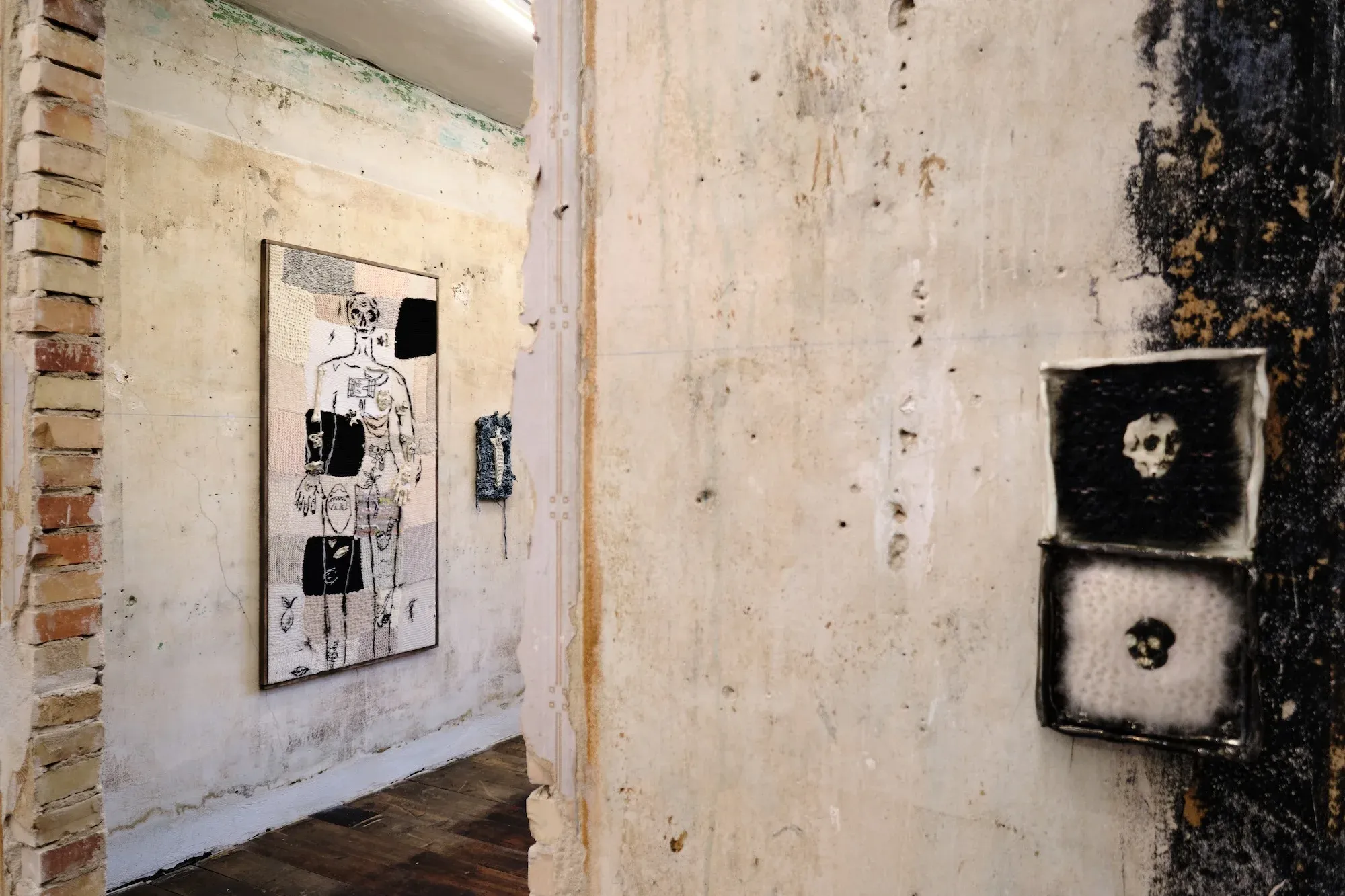 Installation view of Julie Wittrup’s solo exhibition Echo at HAGD Contemporary with textile wall works and woven figure panel