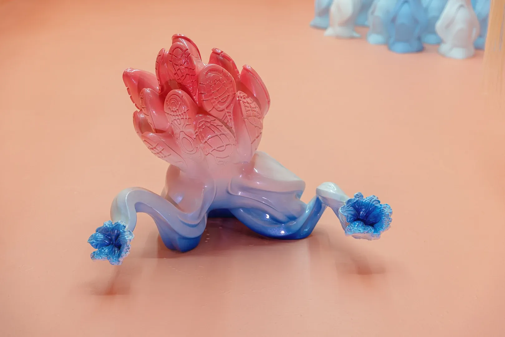 Detail of organic gradient sculpture by Patricia Piccinini at Passage Gallery Sydney showing pink and blue biomorphic form with tentacle-like extensions