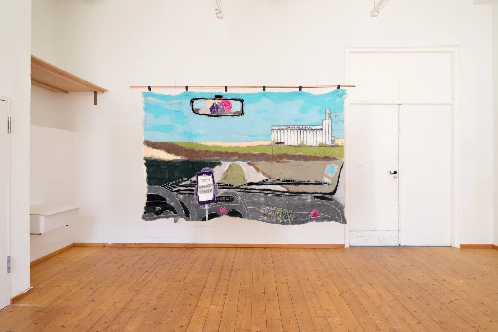 Pierre-Yves Delannoy, Fières pouilleux (2024), large felt textile wall hanging depicting a car interior and rural landscape, contemporary textile art installation exploring memory, travel and everyday imagery.