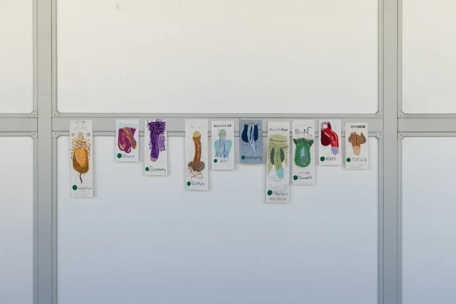 Pierre-Yves Delannoy, Embroideries on Cashier’s Ticket (2024), series of embroidered supermarket receipts displayed in a row, transforming everyday transaction slips into colorful textile-based drawings and sculptural surfaces.