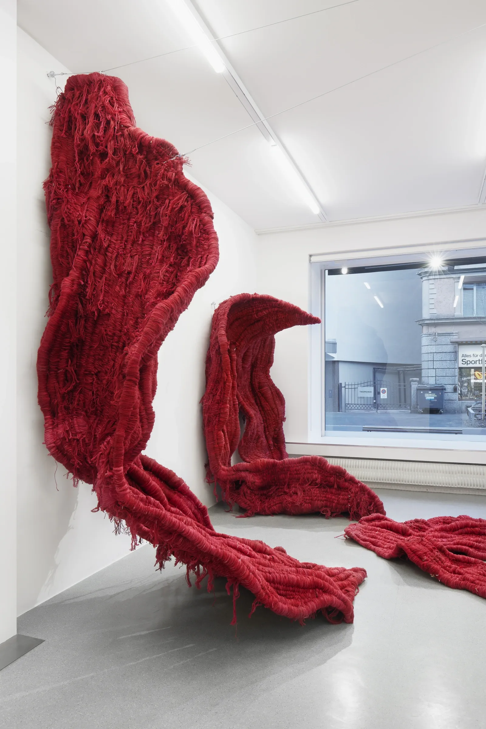 Soojin Kang red textile installation covering gallery floor