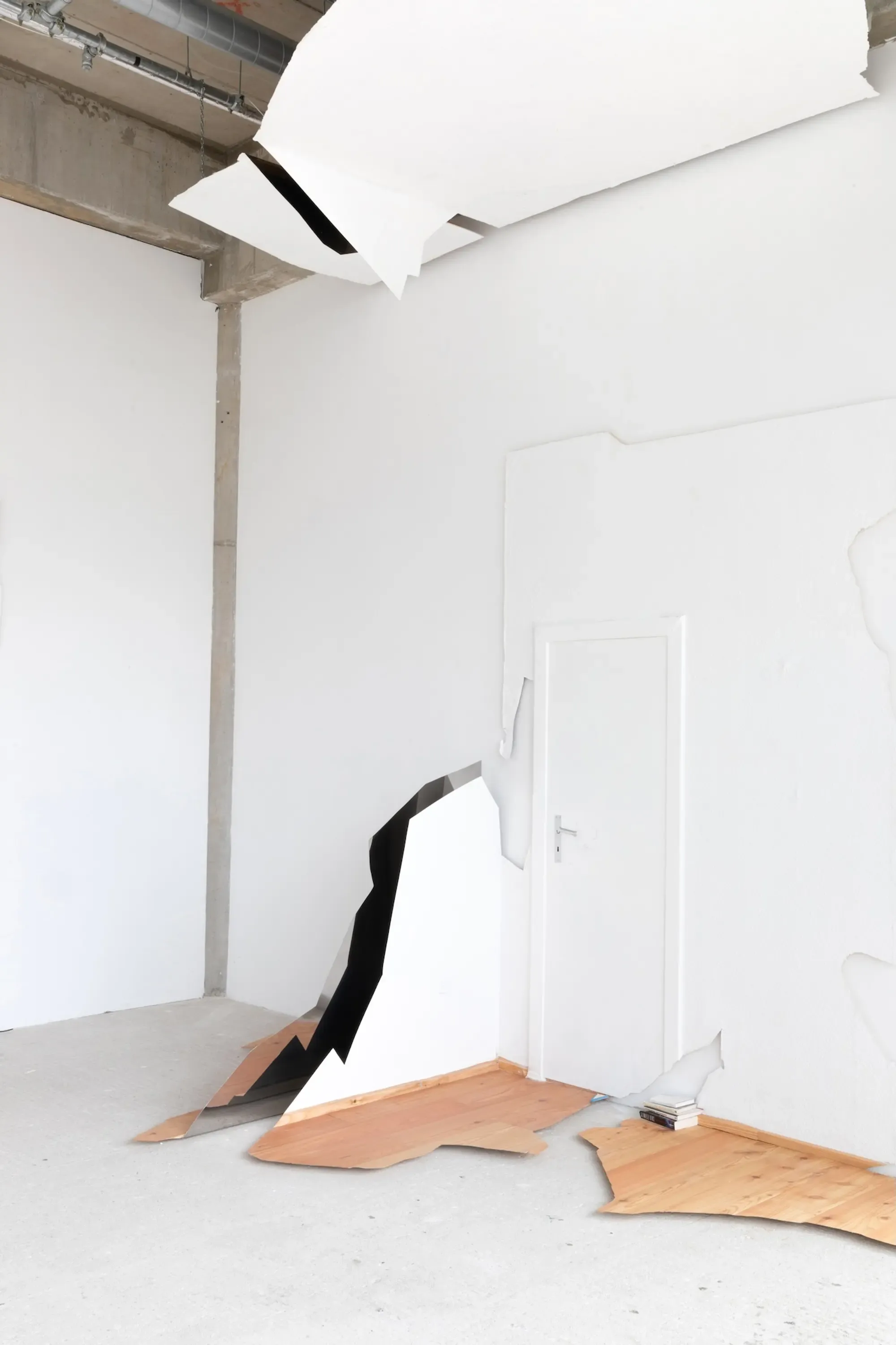 Installation view of Tobias John’s Fails (2025), a sculptural architectural intervention with torn wall surfaces and exposed black interior structures at ayayay Frankfurt