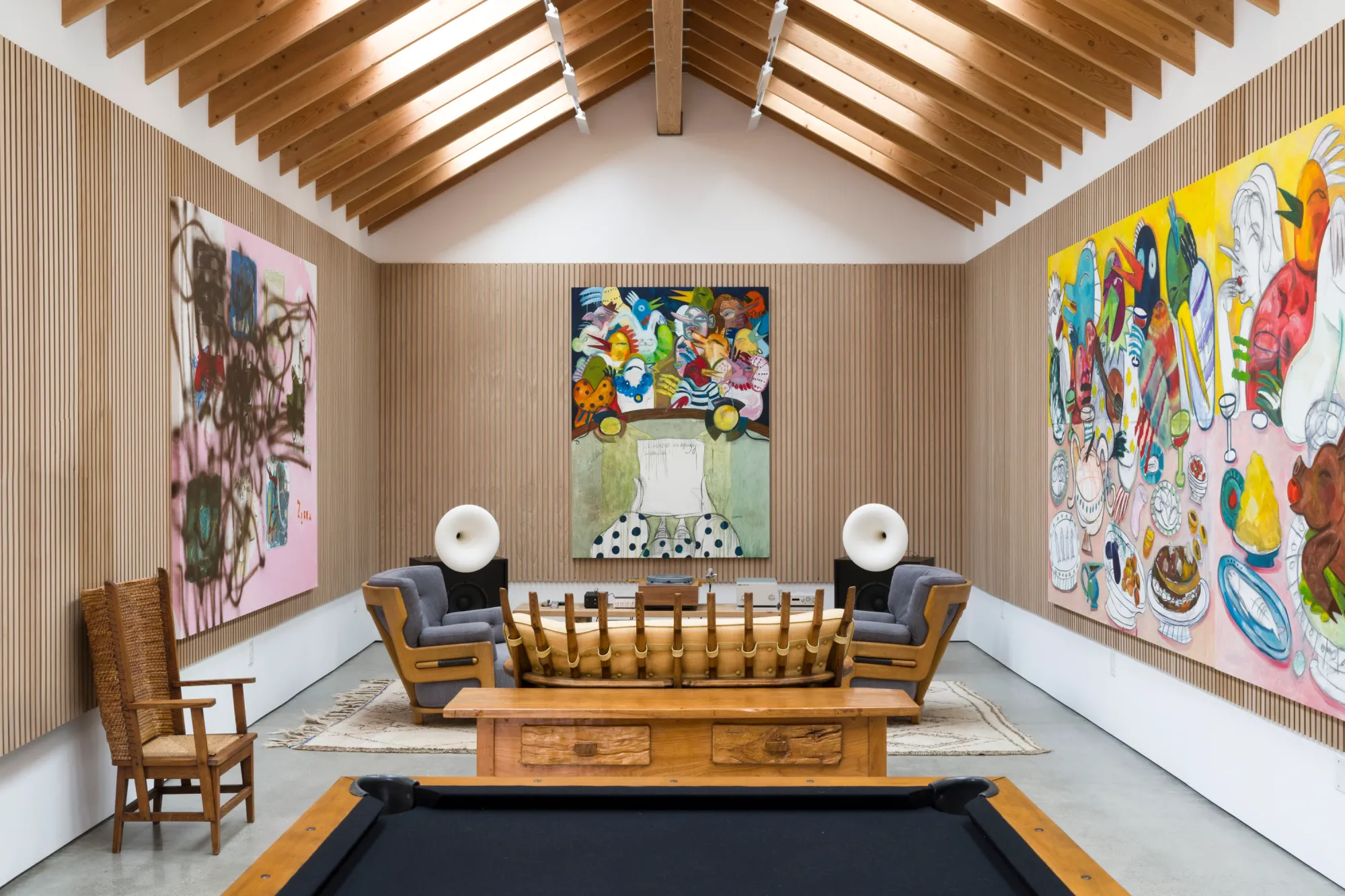Installation view of Dinner Table at Simchowitz Hilltop, Los Angeles, featuring large paintings by Andrey Samarin and Lera Derkach displayed in a wood-lined gallery interior with pool table and lounge seating