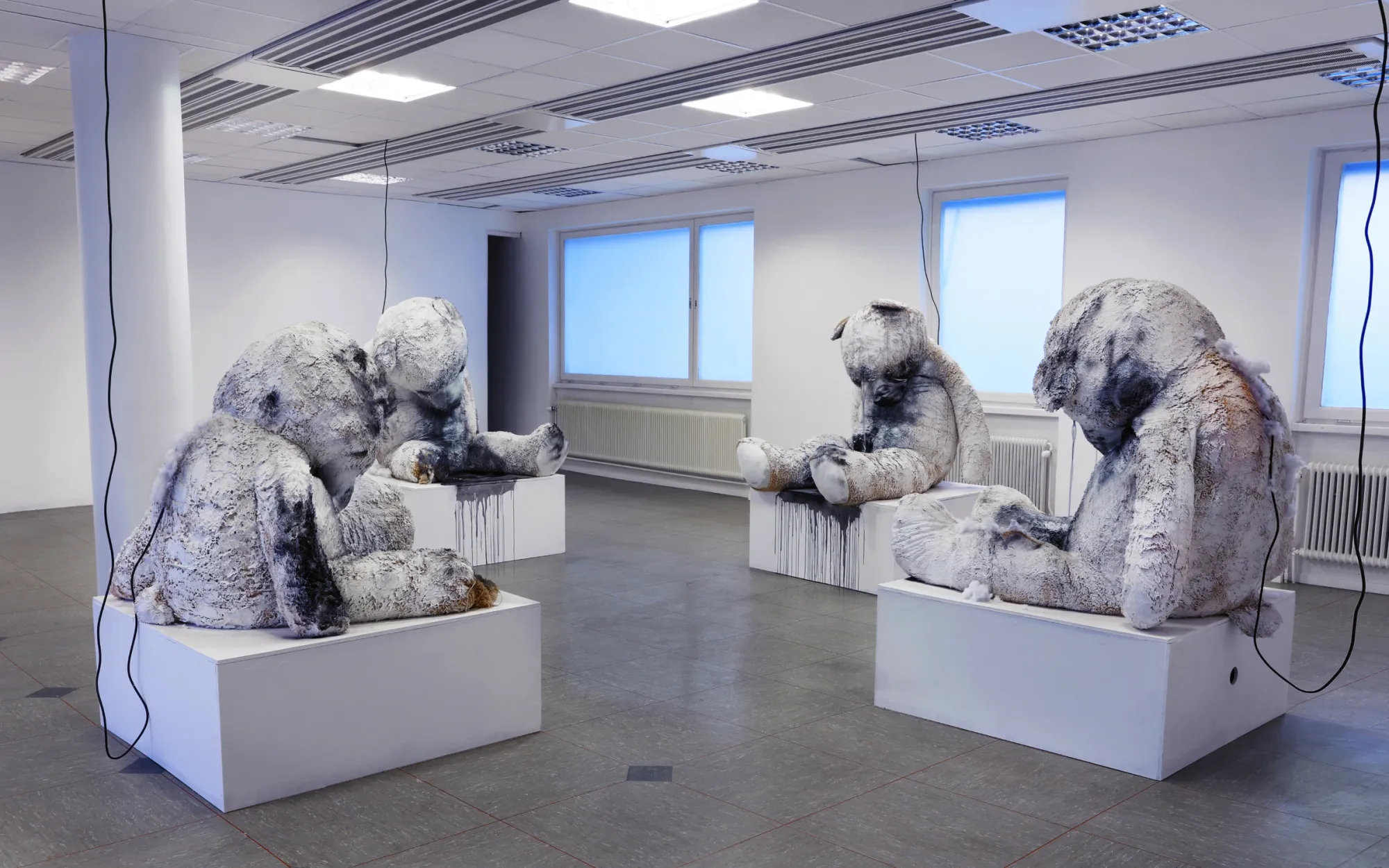 Andreas R Andersson:  Installation with damaged stuffed animal sculptures in gallery space, Fountains Where the Flood Begins, Råneå 2025, Photo Isak Anshelm