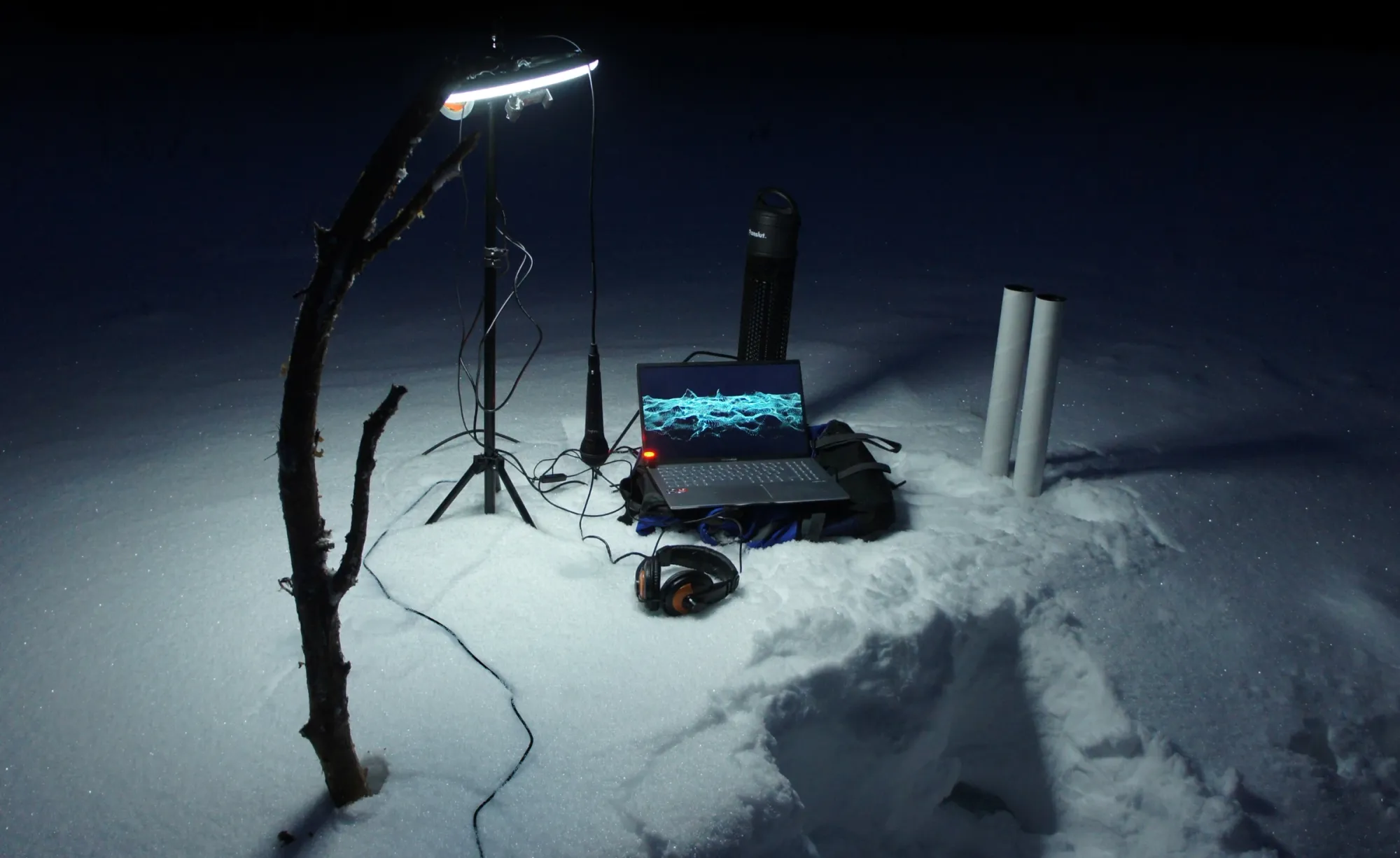 Andreas R Andersson, Night scene with laptop and recording equipment in snow, Work in Progress, Karesuando 2022, Photo by Andreas R Andersson