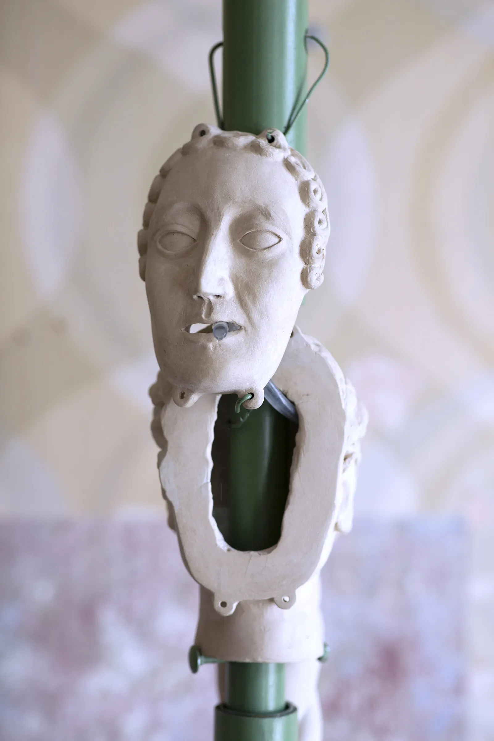 Detail of Céline Struger EQUALIZER II showing ceramic elements attached to green steel structure