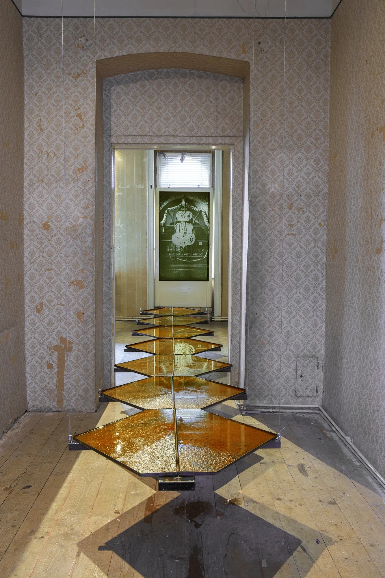 Céline Struger TRANSVERSE ORIENTATION installation with steel and water forming a linear sequence across exhibition space