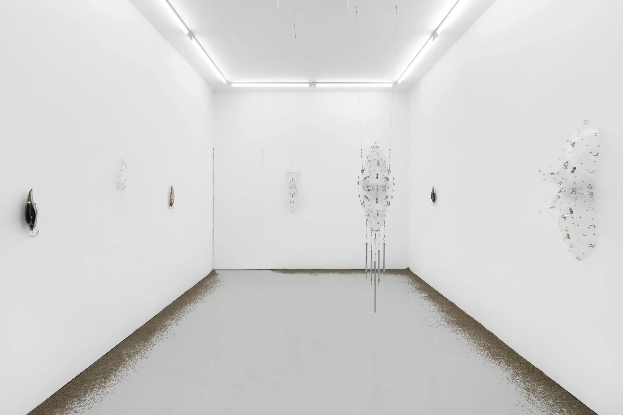 Installation view with suspended PVC orthosis sculpture, glass ear works and lavender on floor, Floryan Varennes at Xxijra Hii London