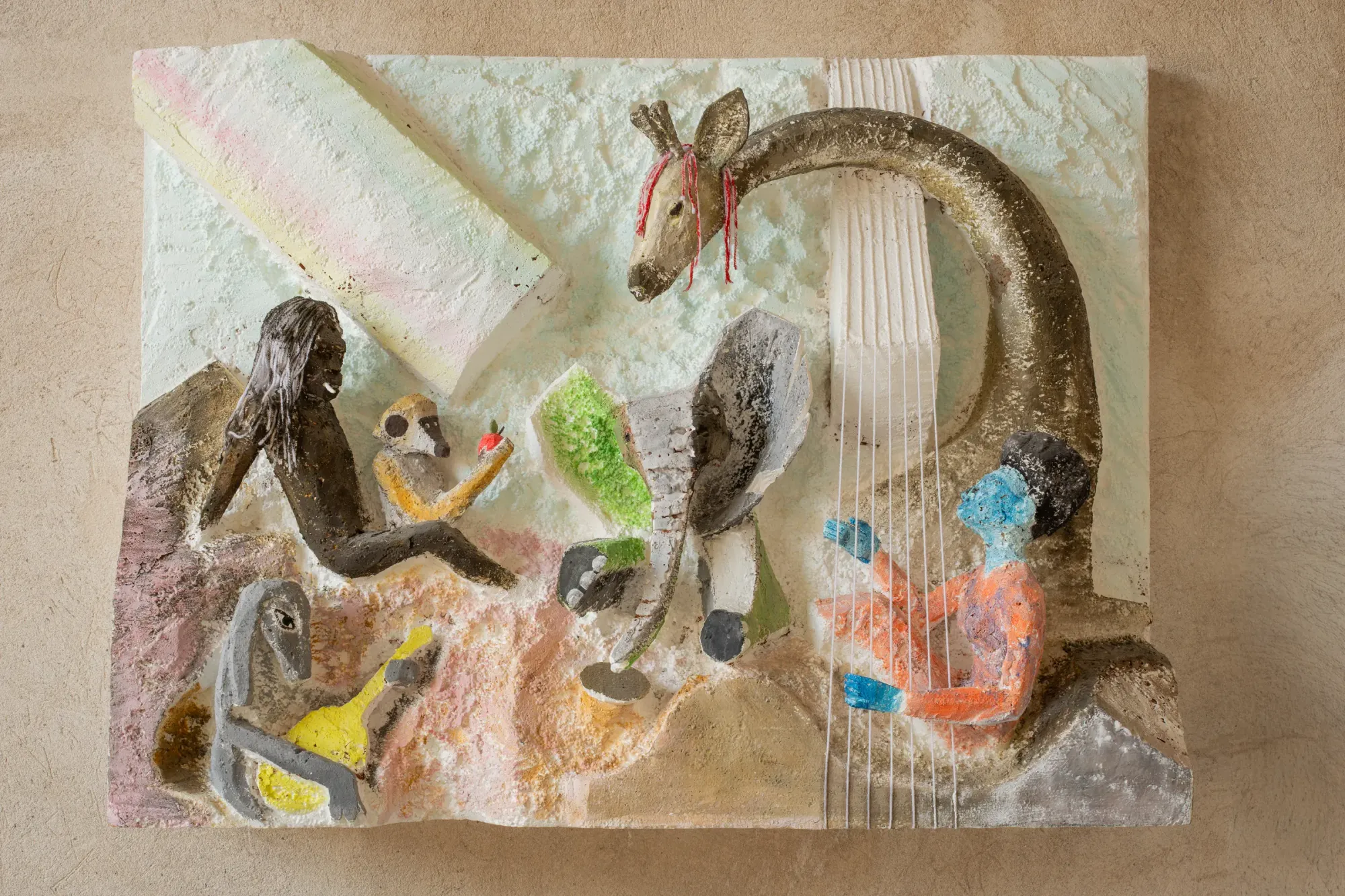 Lin May Saeed Untouchability 2025 exhibition view Sapieha Palace Vilnius relief sculpture with human and animal figures including elephant and harp-like structure