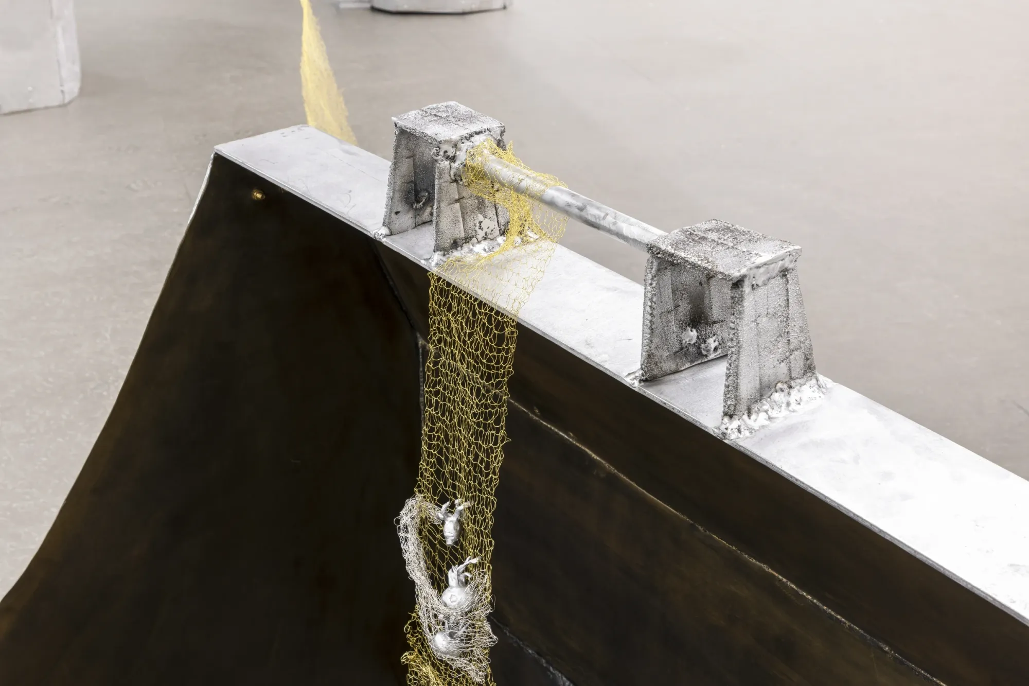 Maija Fox Hard Shoulders detail showing metal bar structure with woven wire and cast aluminium elements attached at Sinne Helsinki