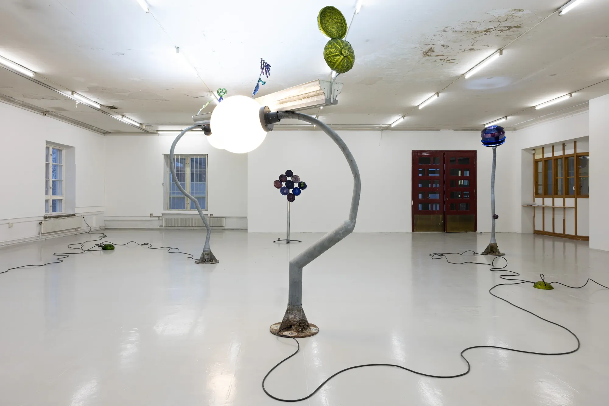 Installation view of Worker Ant After Work (2026) by Matti Sumari at SIC Helsinki featuring sculptural street lights and anodized aluminium works