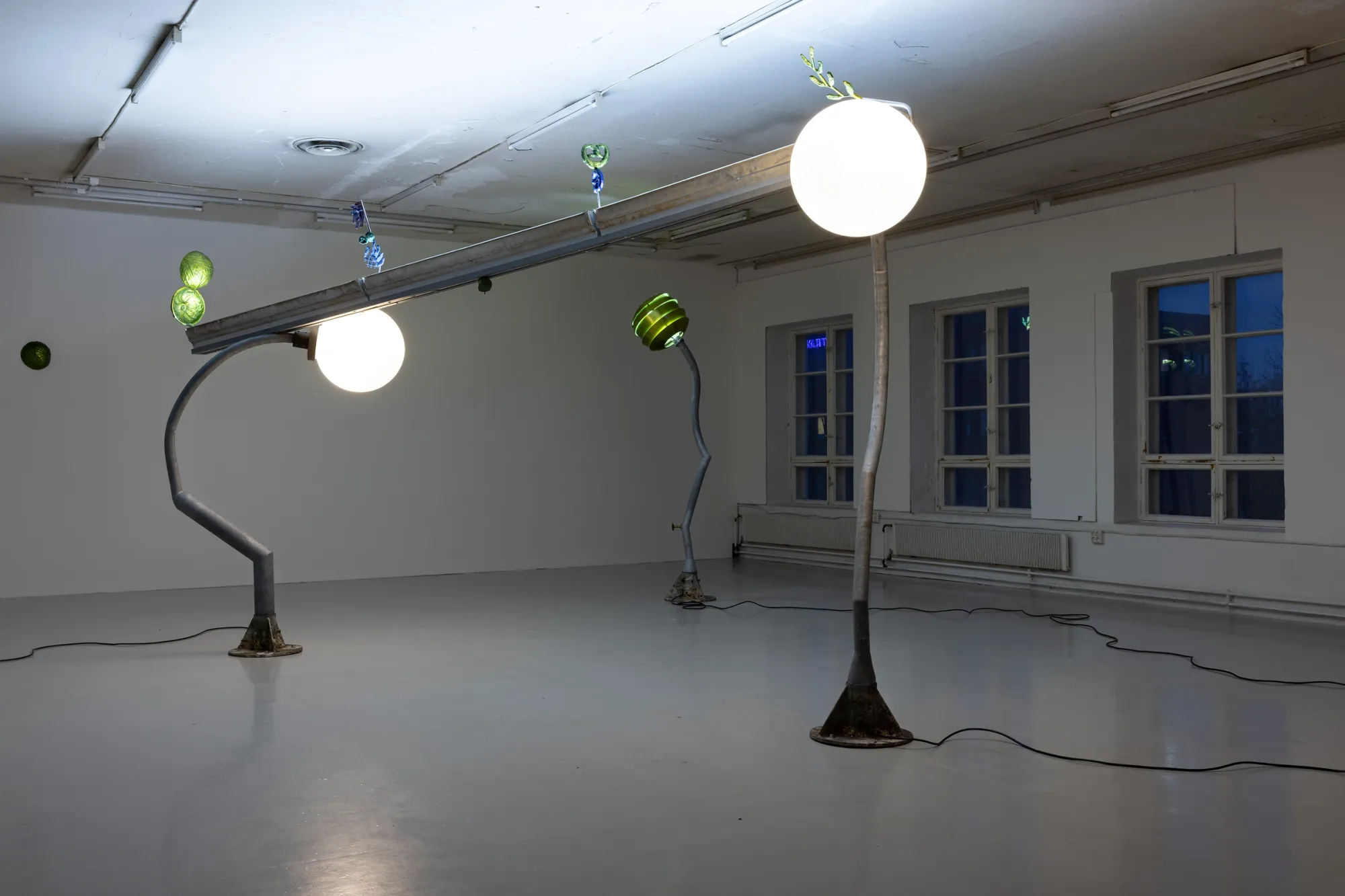 Installation view of "Worker Ant After Work" (2026) by Matti Sumari at SIC Helsinki, featuring sculptural street lights and oscillating gallery lighting referencing cycles of work and rest