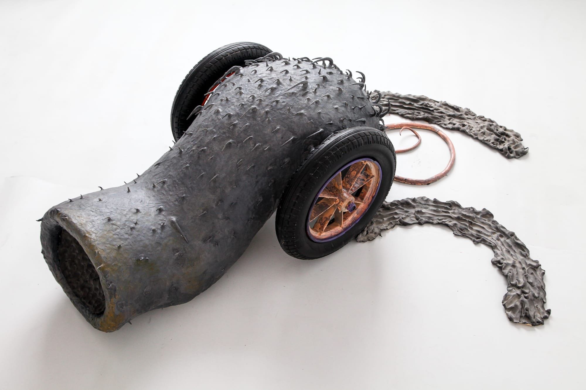 Shirley Fu Blood on Track 2 2024 hybrid sculpture with tyre body spiked surface and wheel elements mixed media installation