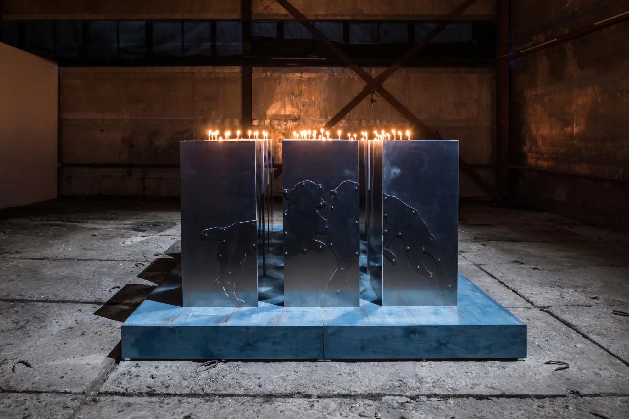 Stasia Grishina aluminium installation with dog silhouettes and candlelight ritual contemporary art Moscow