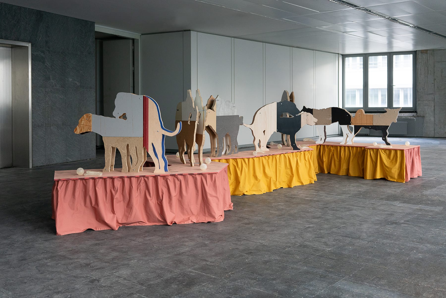 Stasia Grishina detail wooden animal sculptures on fabric podiums installation about control memory and human animal relationship