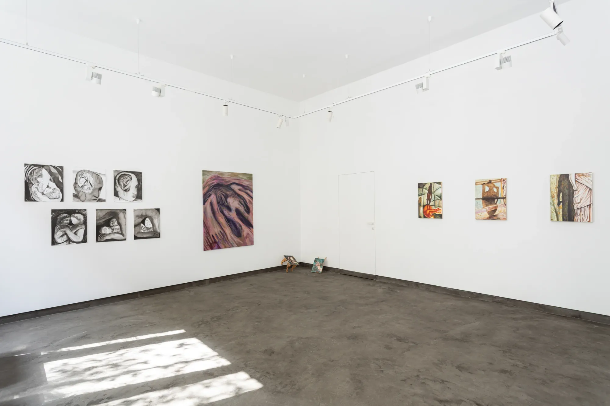 Exhibition view, Inner Spaces, Gallery Rechnitzer, Budapest, 2026, showing installation and paintings by Emma Kling, Júlia Csapó, and Eszter Kálóczy, white gallery space with multiple wall-mounted works and central floor objects.